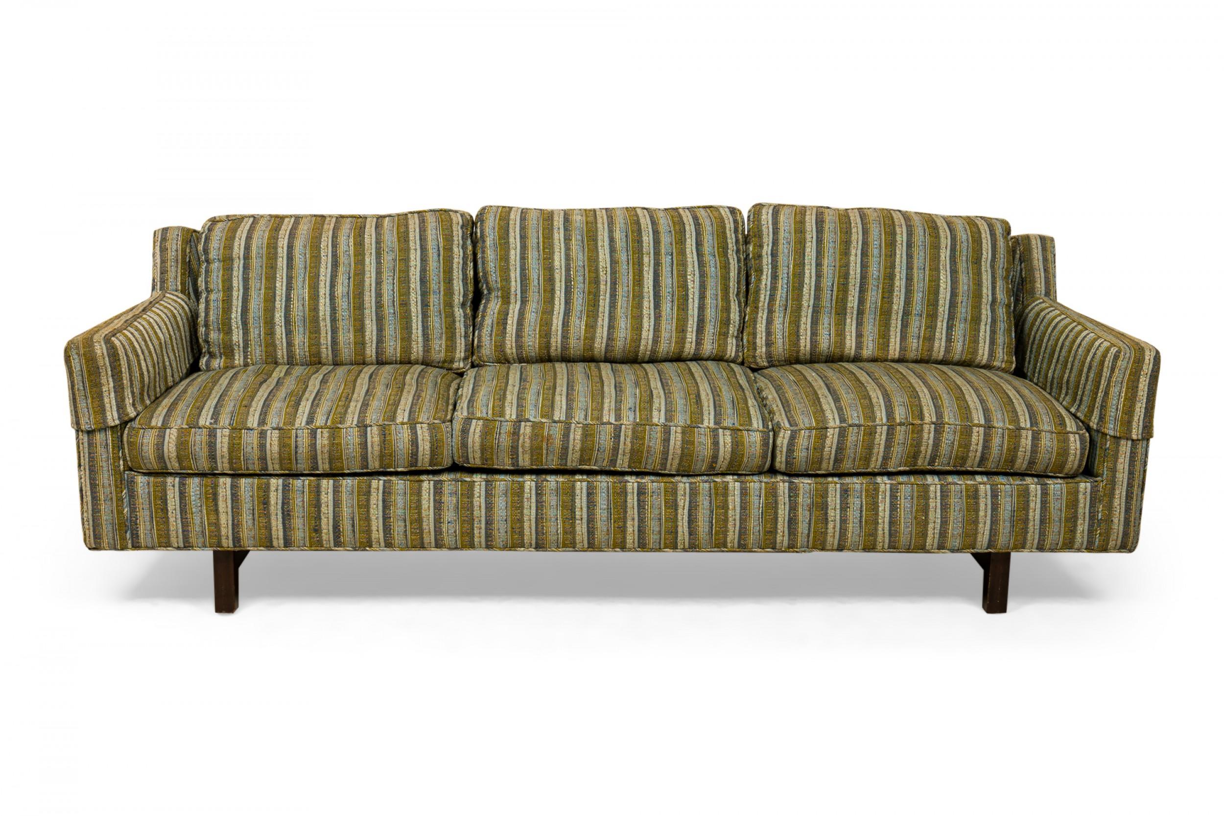 American Mid-Century 3-seat sofa with beige, light green, and brown striped upholstery with three back and three seat cushions. (EDWARD WORMLEY FOR DUNBAR FURNITURE COMPANY).
 