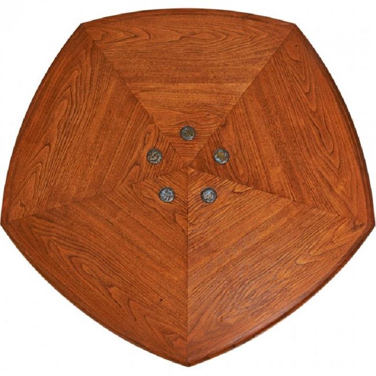 Edward Wormley for Dunbar Janus coffee table. The table is walnut with a geometric shape and the centre has five, round, Tiffany Studios glass tiles.