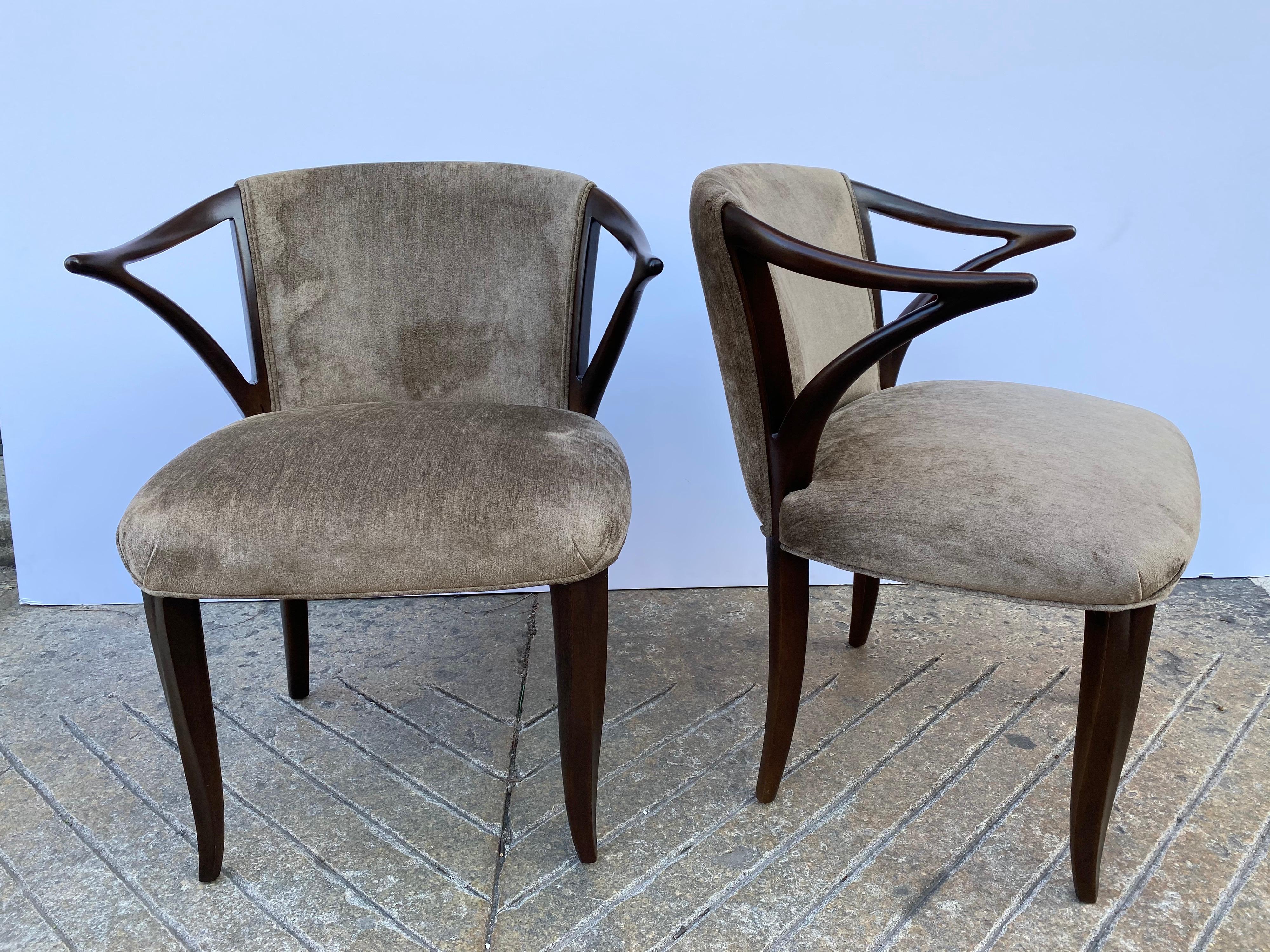 Edward Wormley for Dunbar Janus Collection pair of armchairs. Very rare pair of chairs all redone, newly refinished and reupholstered in a velvet. Beautiful elegant chair with exceptional detail given to the carved legs and arms.