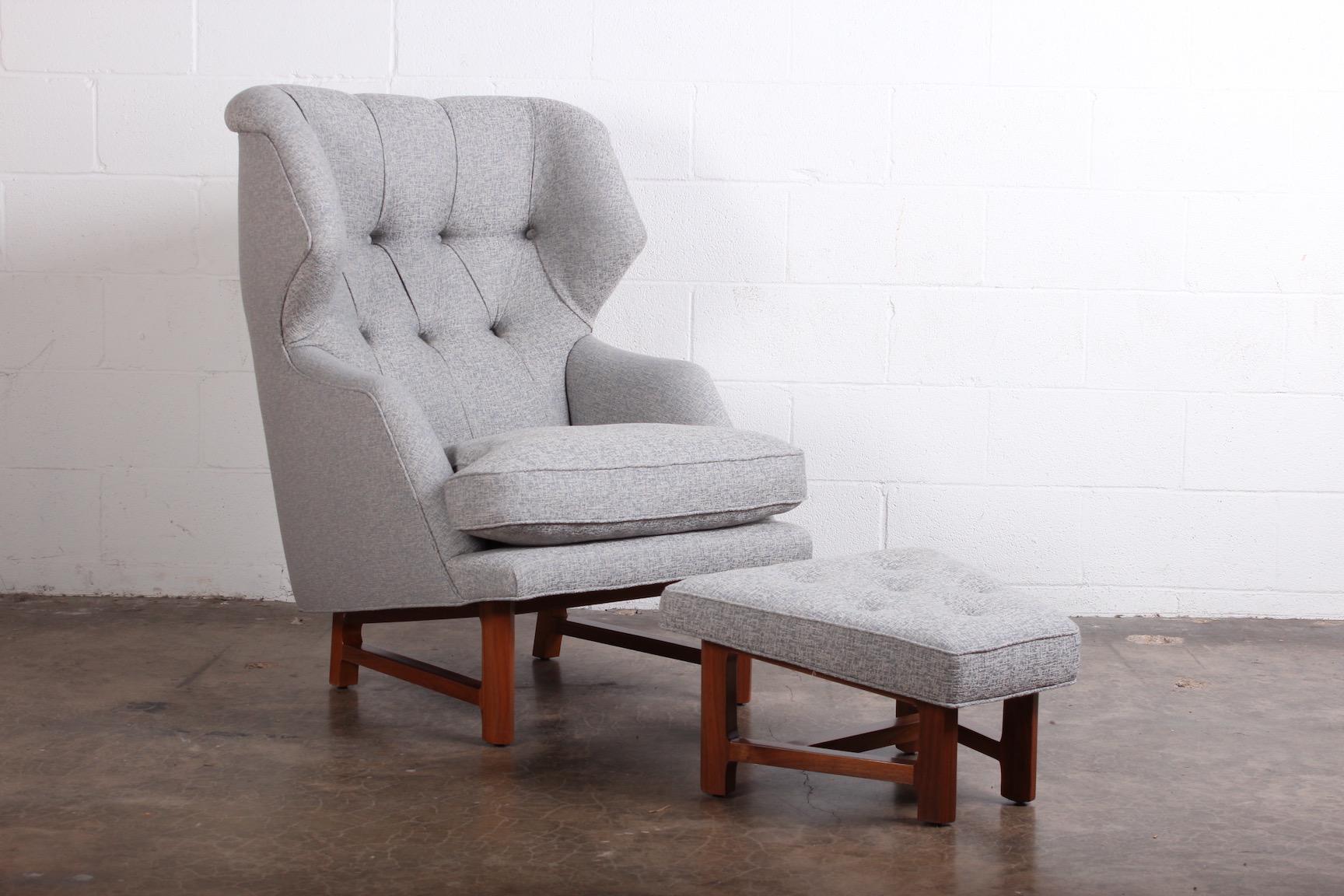 A beautifully restored Janus wing chair and ottoman designed by Edward Wormley for Dunbar.