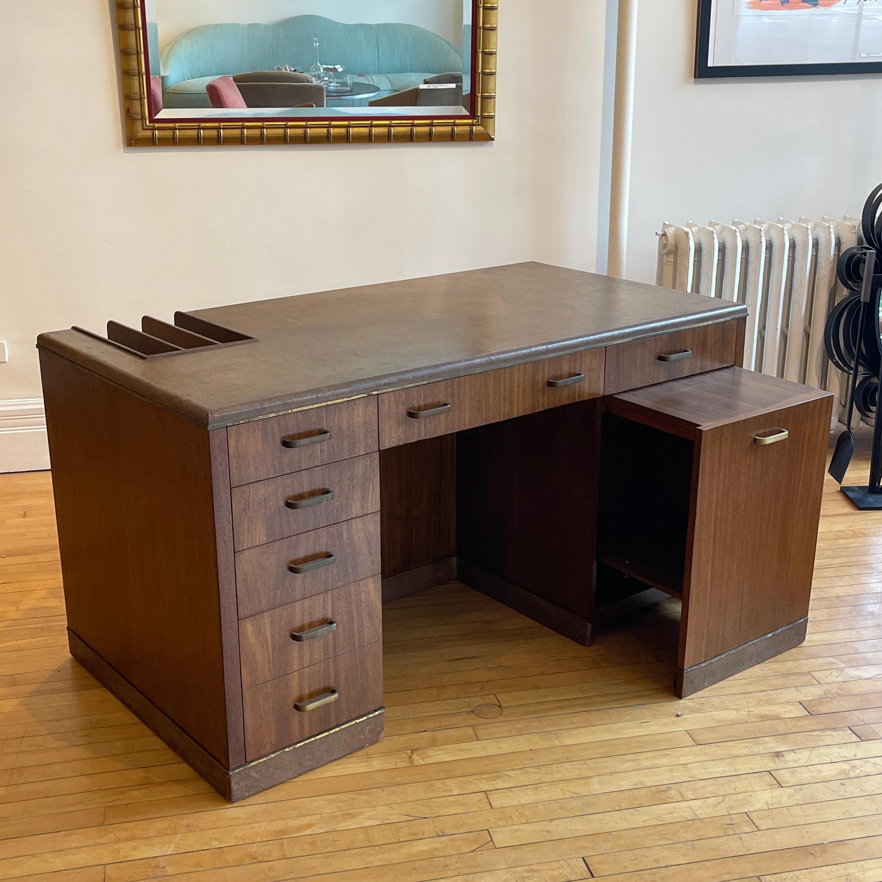 Stunning and rare Edward Wormley for Dunbar convertible desk into desk/ credenza. Credenza portion stores on right half of desk and rolls out smoothly on hidden wheels for use. Also a unique storage compartment in front of desk. Wood has been