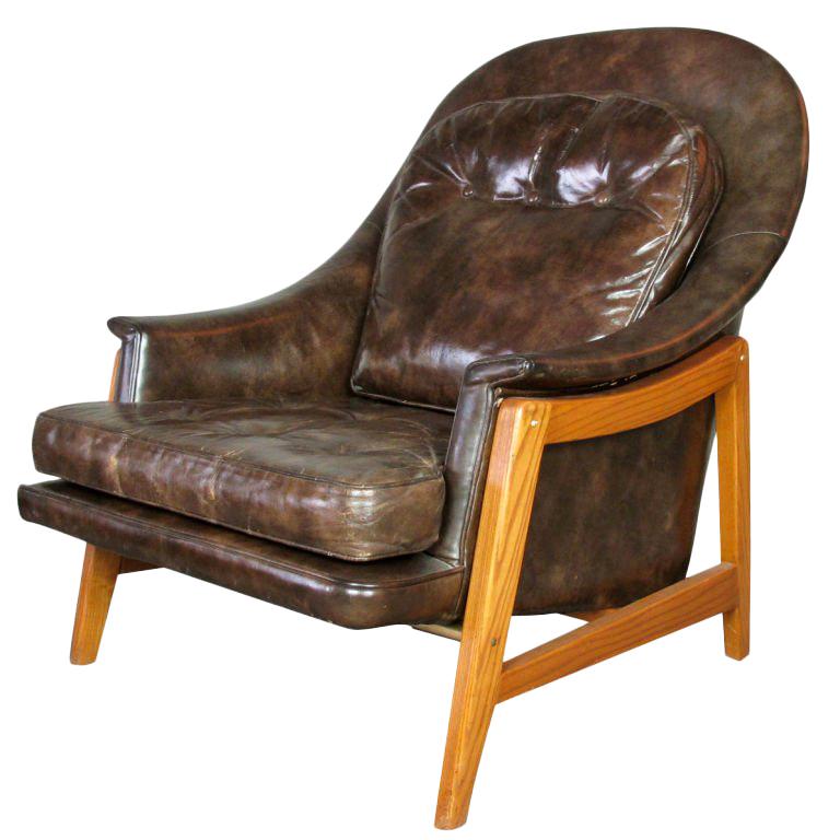 An all original lounge chair designed by Edward Wormley in 1957 for the Dunbar Janus line.  Rich brown glazed leather has a beautiful patina which can not be replicated.  Chair has Dunbar deck cloth.