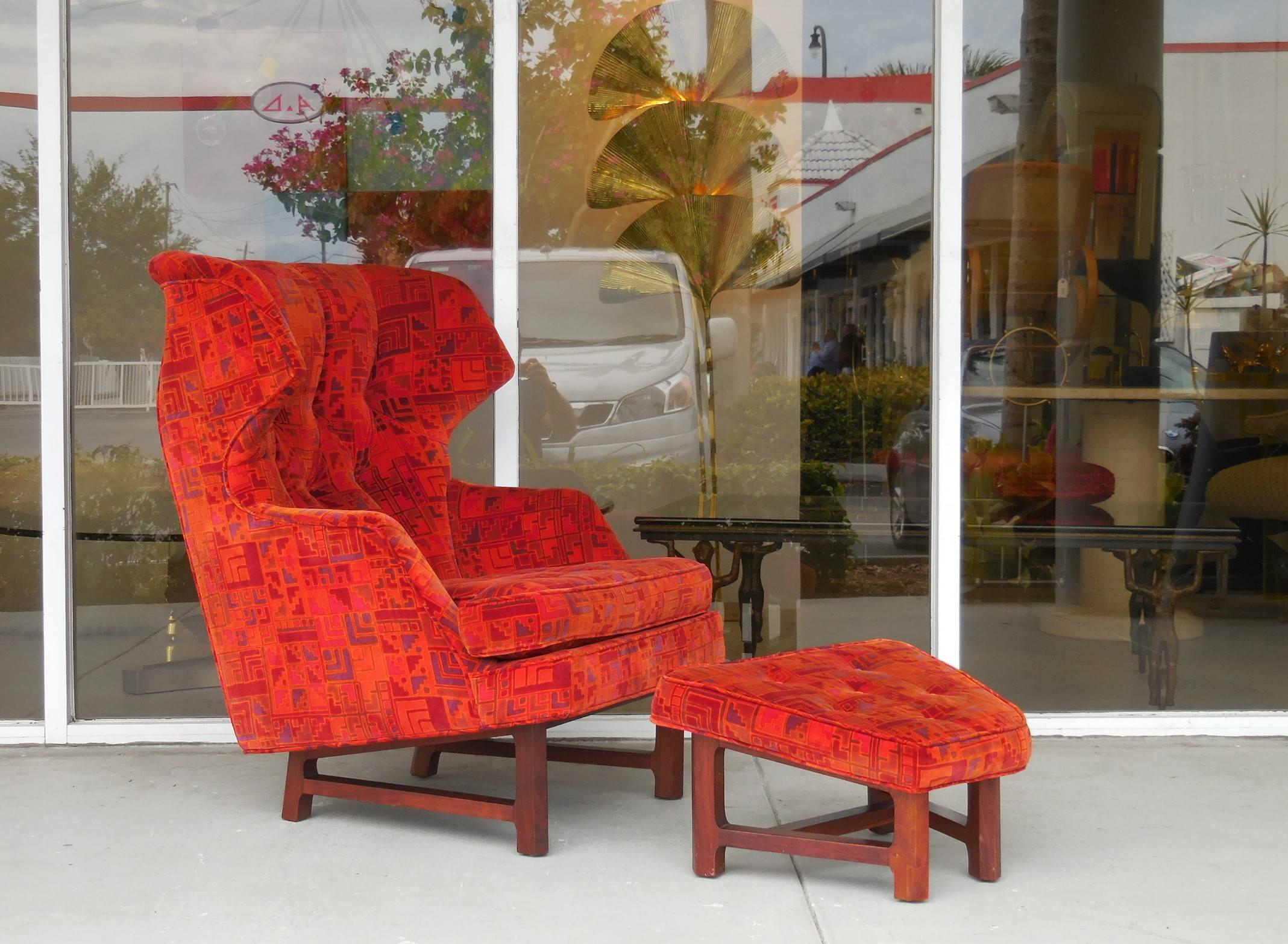 Elusive and super comfortable chair and ottoman by Edward Wormley for Dunbar. Model # 5761 from the Janus Collection. Solid walnut bases. The original upholstery by Lenor Larsen is in excellent condition.
  