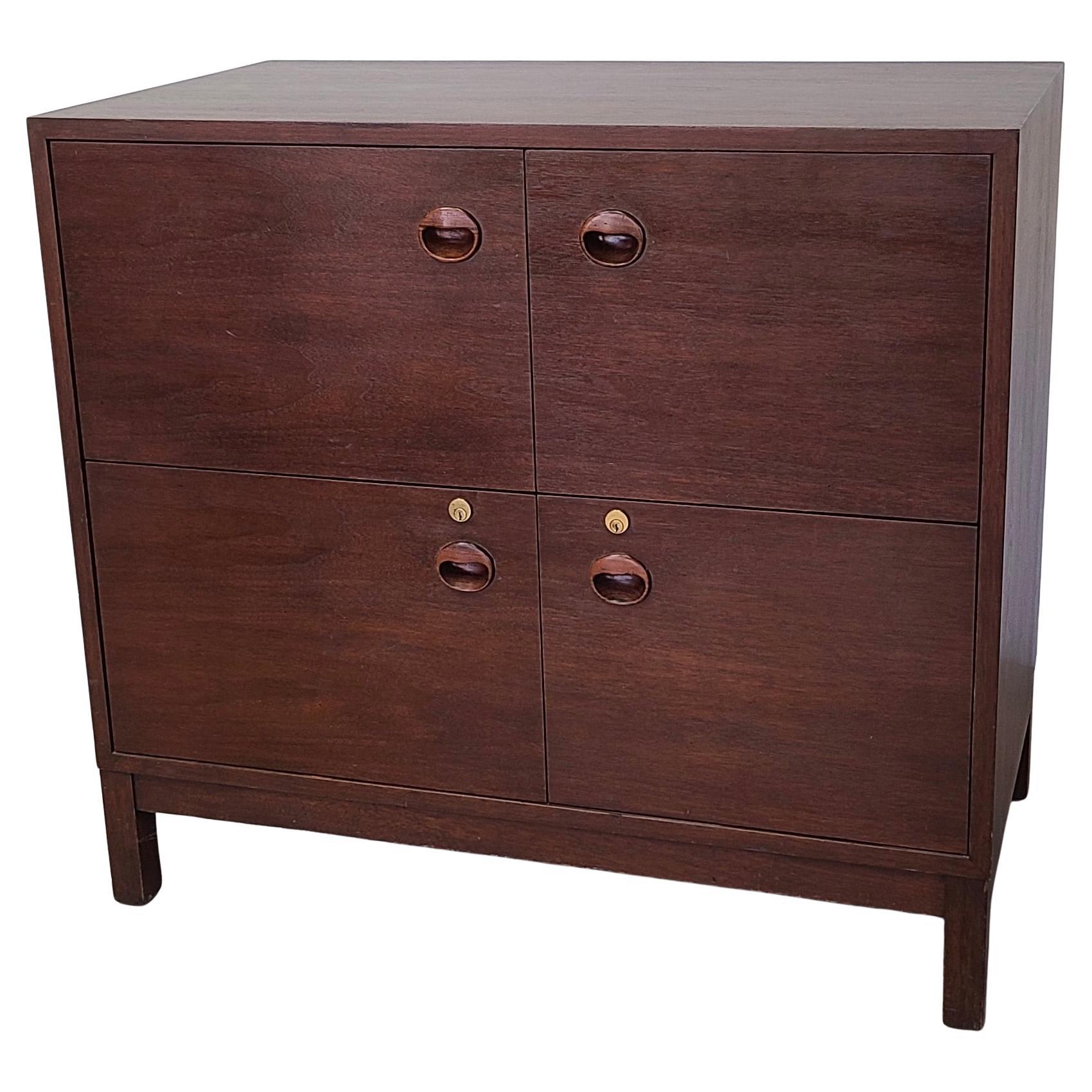 Please feel free to reach out for efficient shipping quote to your zip.

Edward Wormley for Dunbar file drawer chest in Walnut.