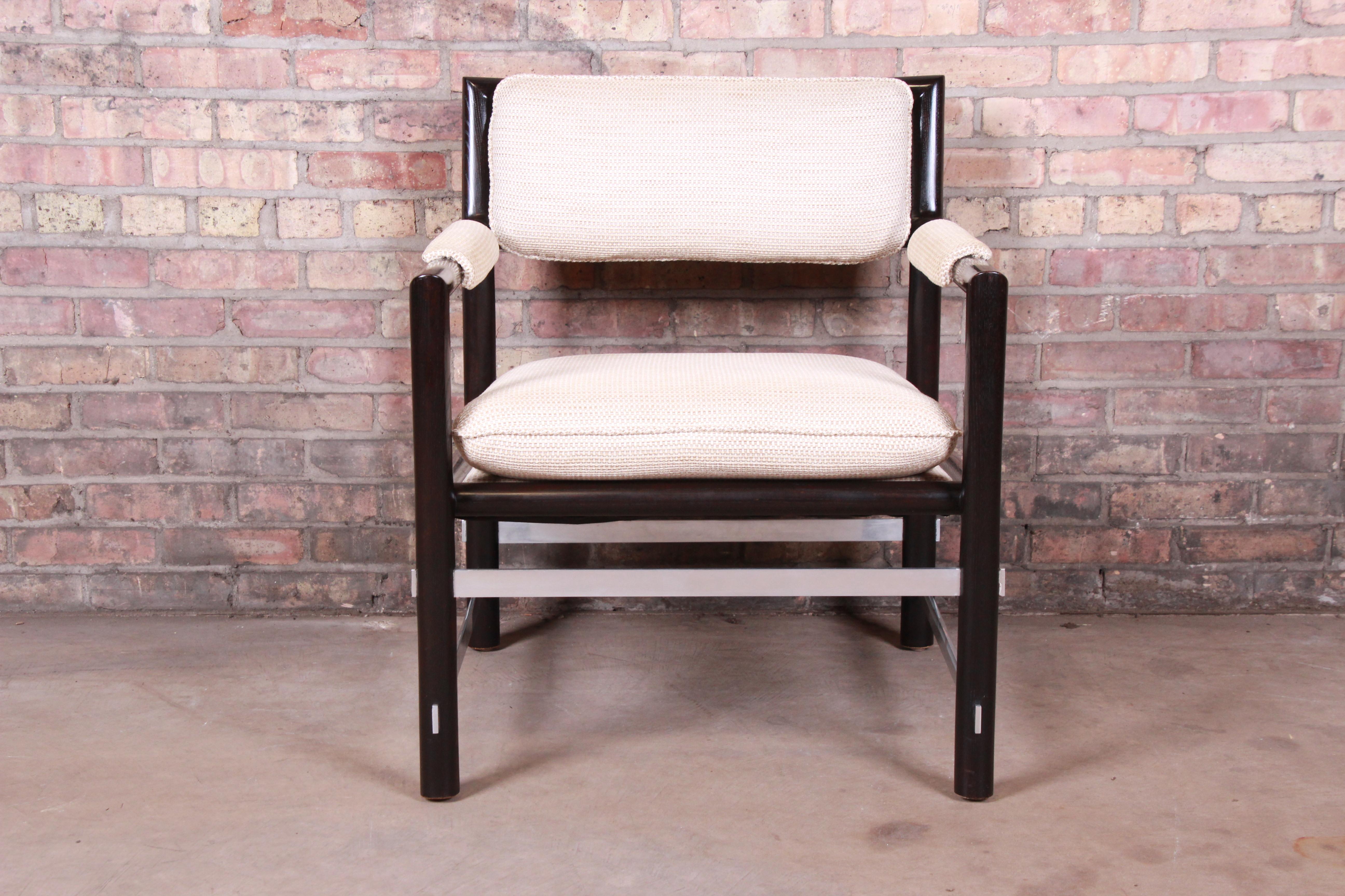 A rare and exceptional Mid-Century Modern club or lounge chair

By Edward Wormley for Dunbar Furniture

USA, circa 1950s

Solid African mahogany frames, with brushed steel stretchers and ivory upholstery.

Measures: 26