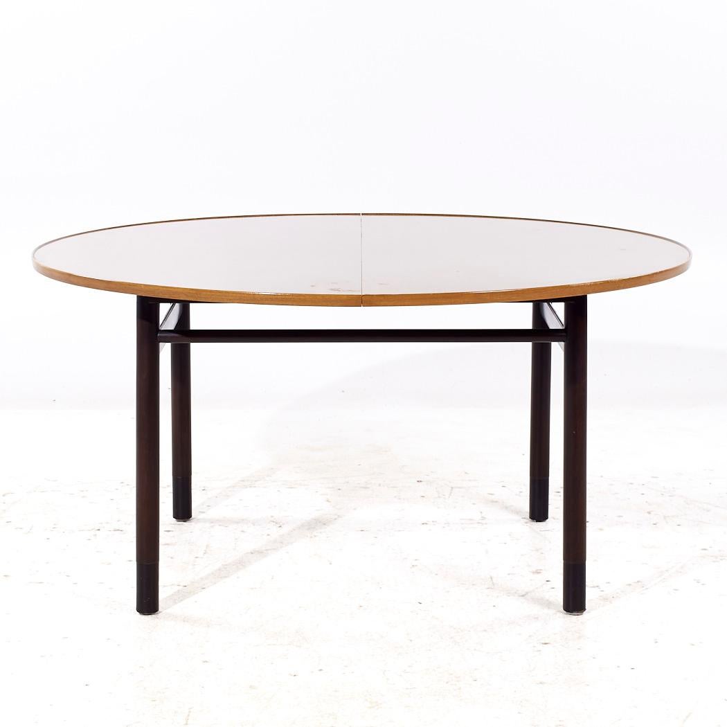 Edward Wormley for Dunbar Mid Century Mahogany Expanding Dining Table with 1 Leaf

This table measures: 60.25 wide x 60.25 deep x 29.5 inches high, with a chair clearance of 28.25 inches, the leaf measures 20 inches wide, making a maximum table