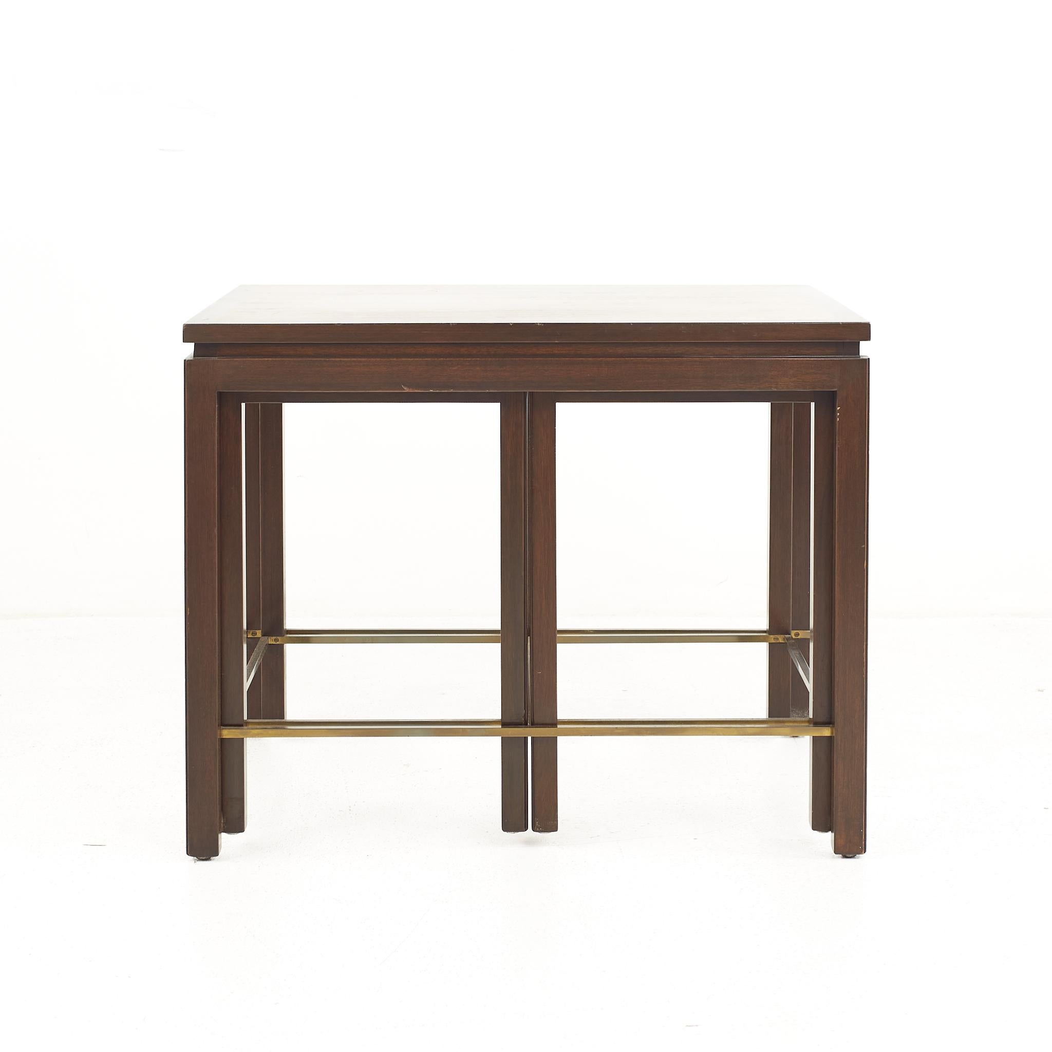 Edward Wormley for Dunbar mid century brass and mahogany nesting table set

The table measure: 28 wide x 20 deep x 22.25 inches high; the nesting tables measure 13 wide x 17.5 deep x 20.75 inches high

All pieces of furniture can be had in what