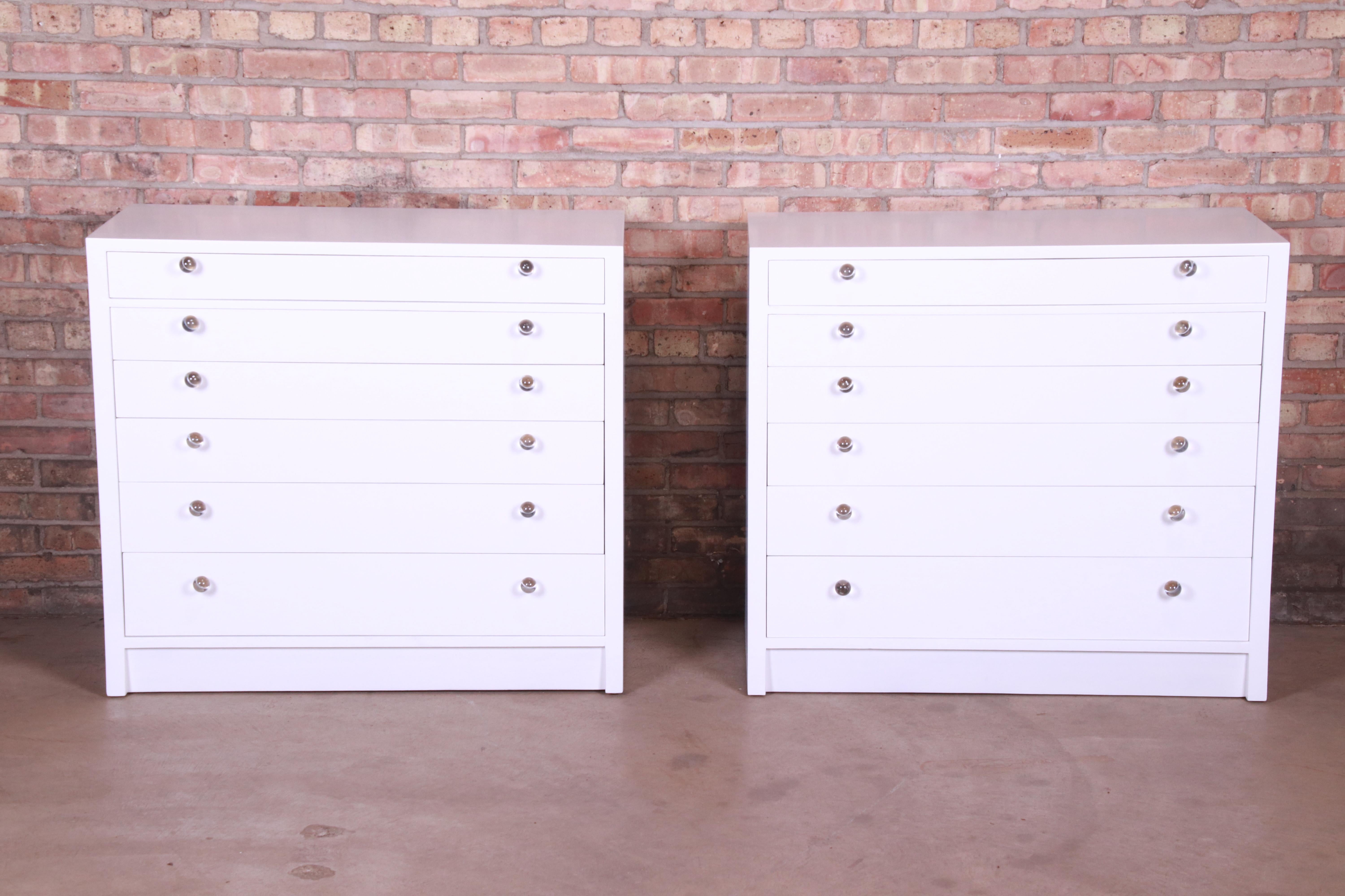 An exceptional pair of Mid-Century Modern six-drawer bachelor chests or large bedside chests

By Edward Wormley for Dunbar Furniture

USA, circa 1950s

White lacquered mahogany, with Lucite and brass drawer pulls.

Measures: 38
