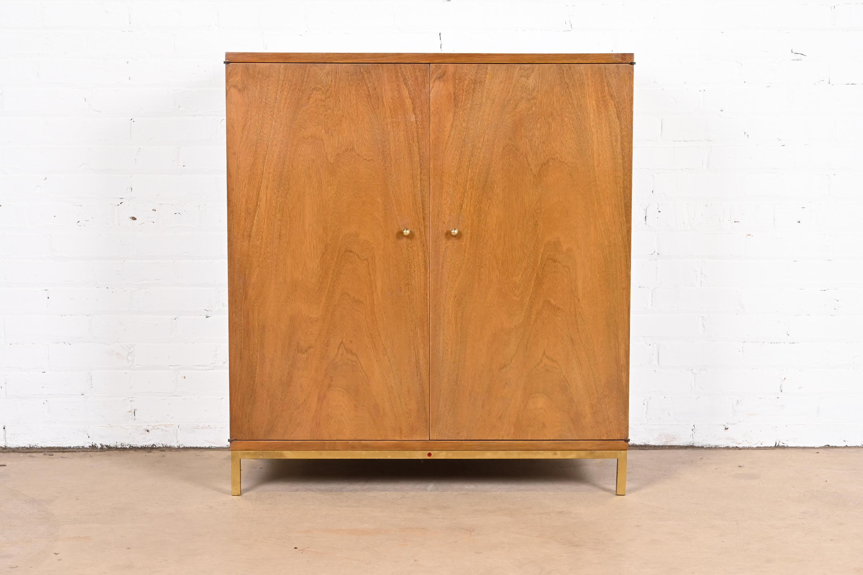 A rare Mid-Century Modern Hi-Fi stereo console or cabinet

By Edward Wormley for Dunbar, with Capehart stereo.

USA, 1950s

Mahogany, with caned panel, and brass base and hardware.

Measures: 34
