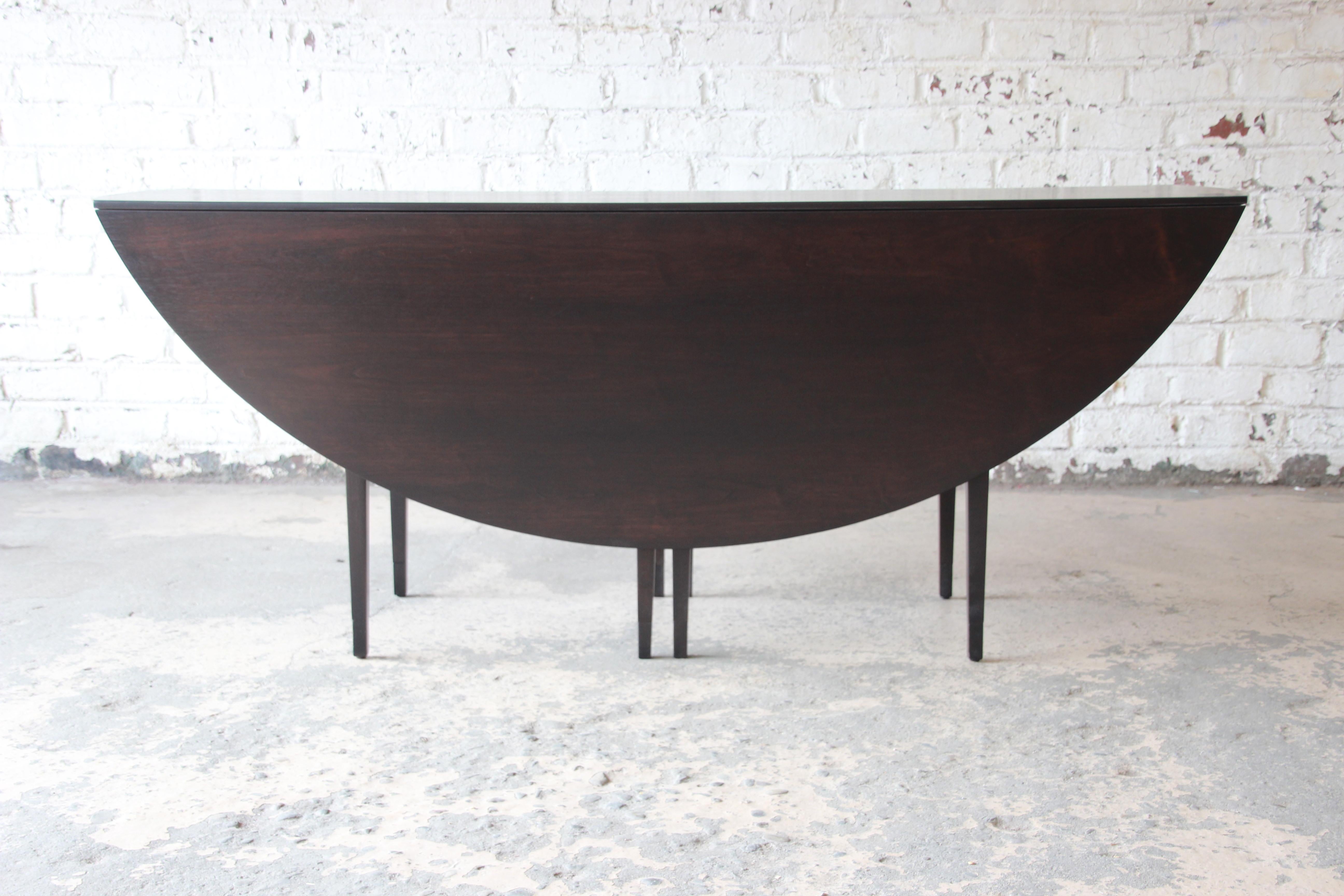 Edward Wormley for Dunbar Mid-Century Modern Walnut Oval Drop-Leaf Dining Table In Excellent Condition In South Bend, IN