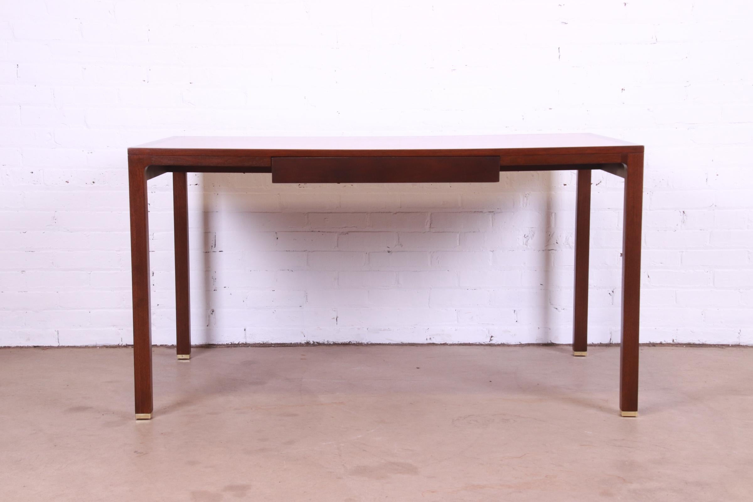 An exceptional Mid-Century Modern writing desk

By Edward Wormley for Dunbar Furniture

USA, 1950s

Patchwork bleached walnut top, with solid walnut legs and brass-capped feet.

Measures: 54