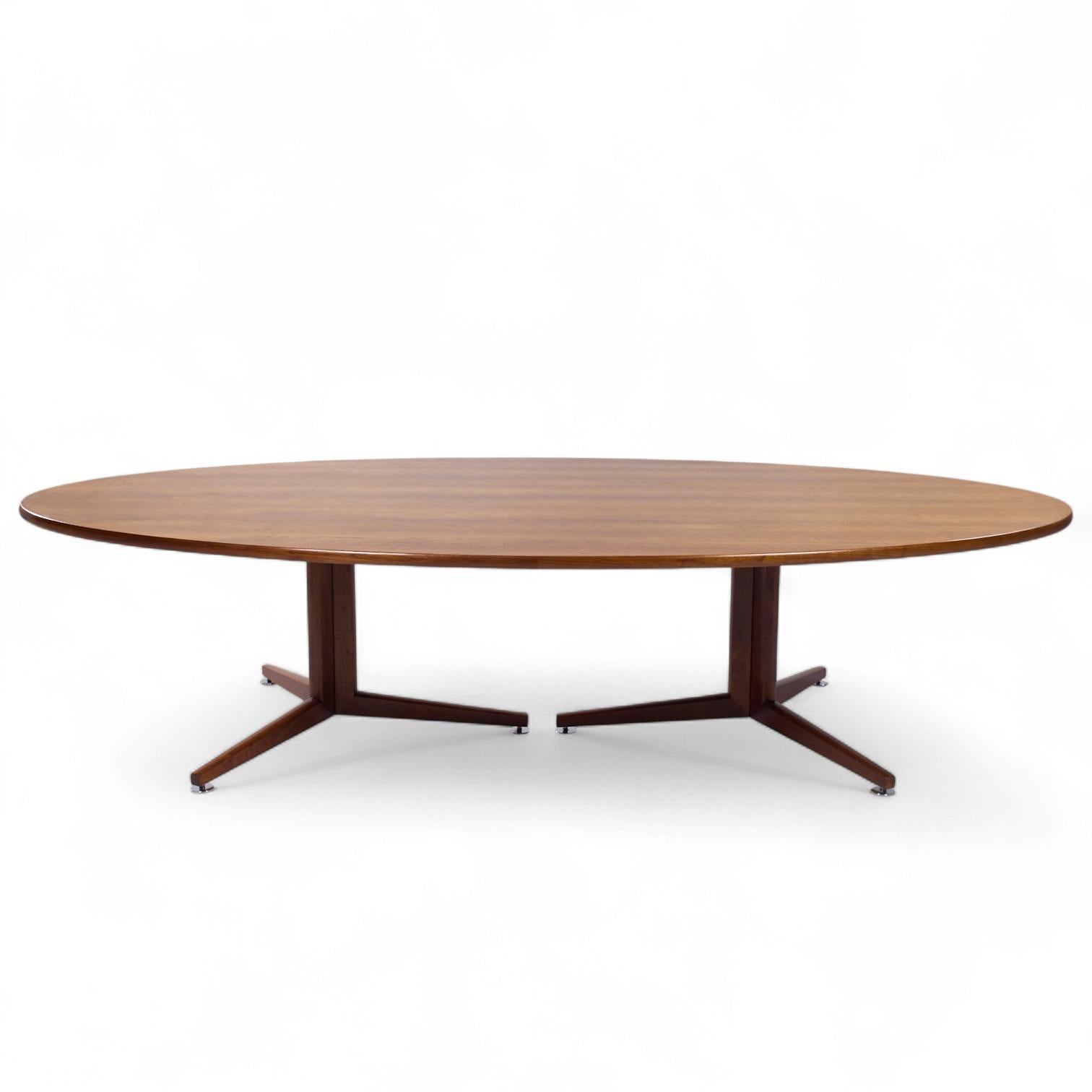 Edward Wormley for Dunbar Mid Century Walnut Elliptical Conference/Dining Table

This dining table measures: 120.5 wide x 63.25 deep x 28.25 inches high, with a chair clearance of 27 inches

We take our photos in a controlled lighting studio to show