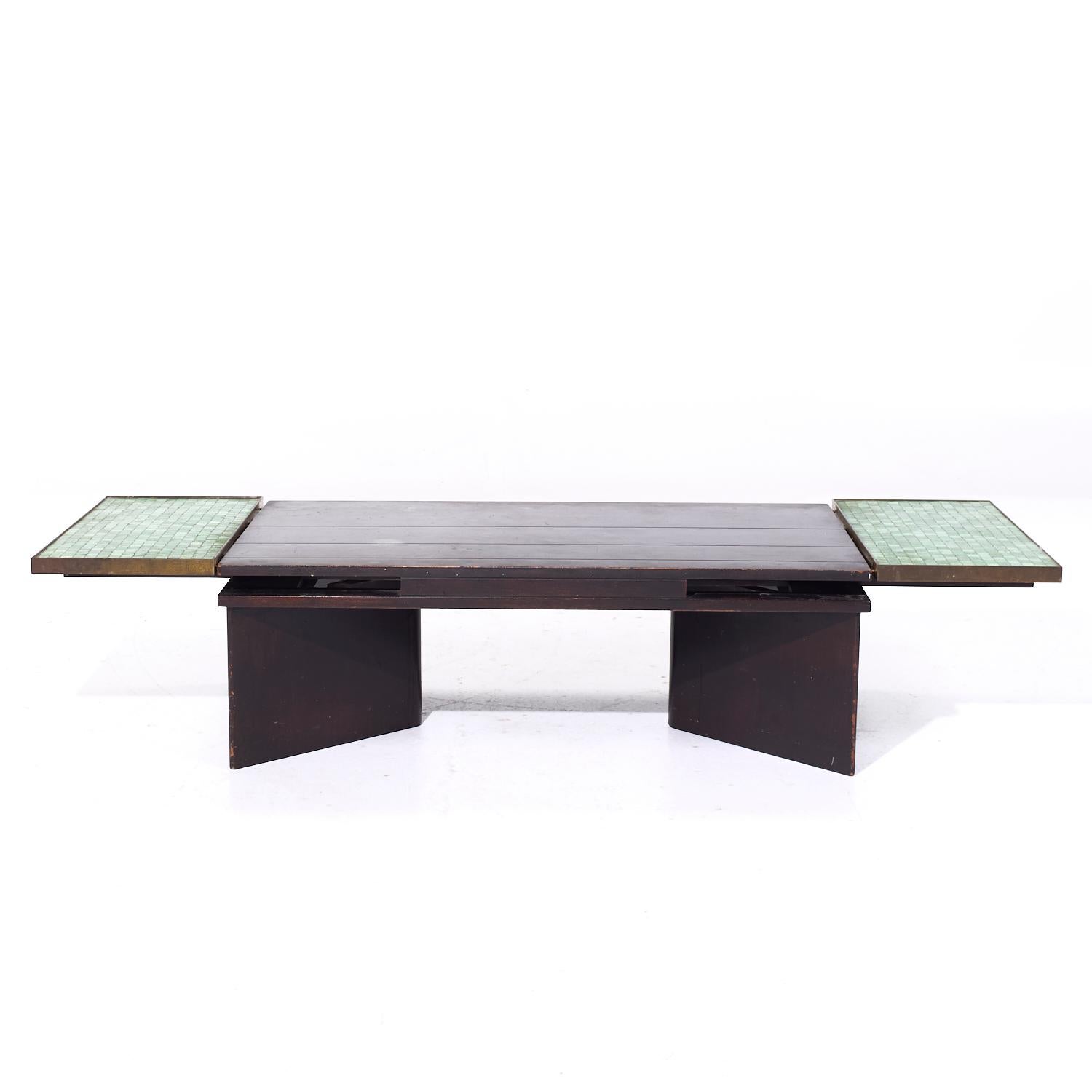 Edward Wormley for Dunbar Model 5427 Mahogany Brass and Murano Glass Tile Coffee Table

This extension coffee table table measures: 44 wide x 24.5 deep x 14.5 inches high. There are 2 expanding leaves that, when engaged, make a the table 69