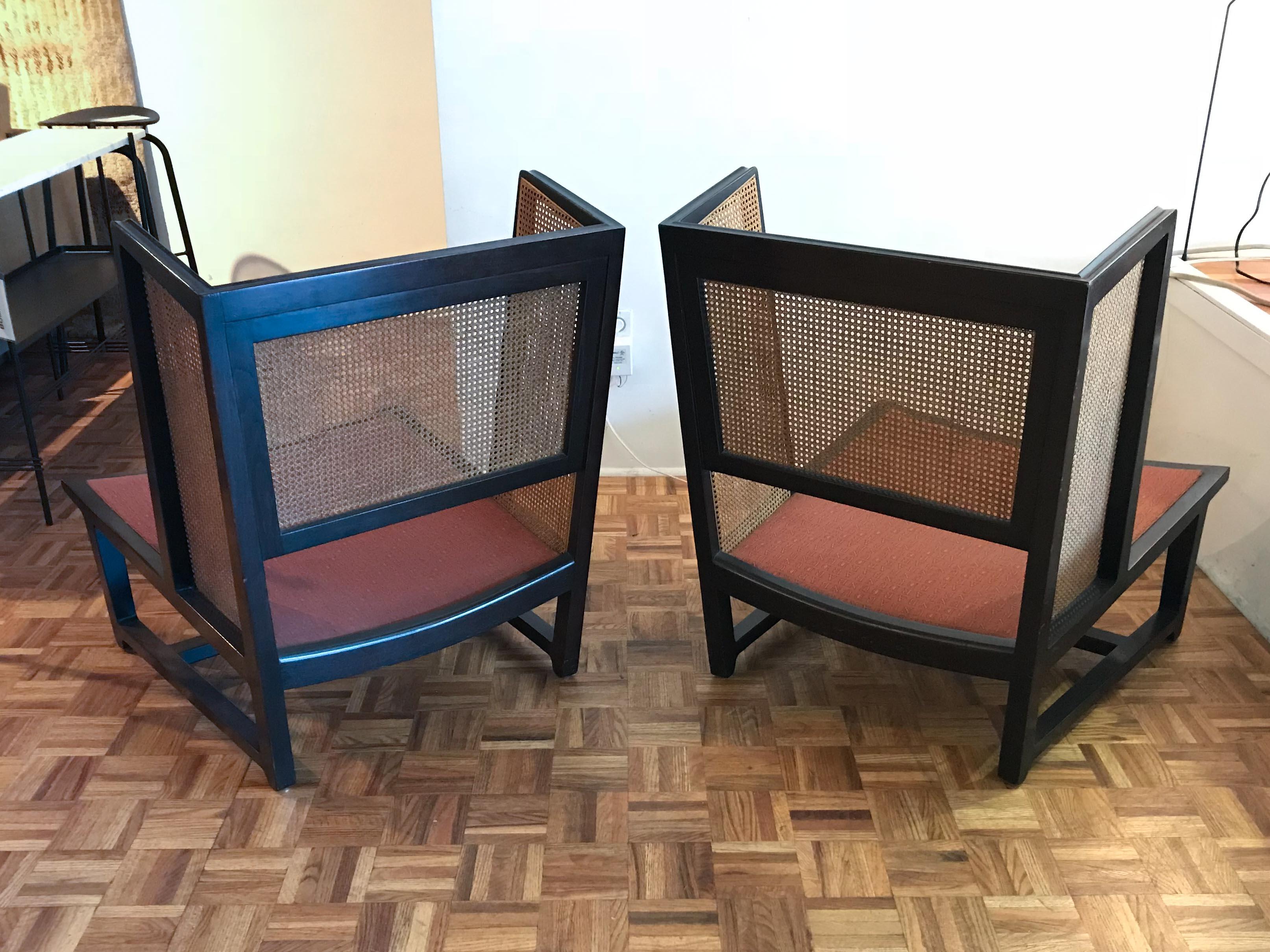 A rare pair of Edward Wormley for Dunbar cane back wing chairs, circa 1960, model no. 6016. Mahogany frames with cane panels, original condition not yet refinished, cushions not included. Good overall vintage condition, solid frames with some wear