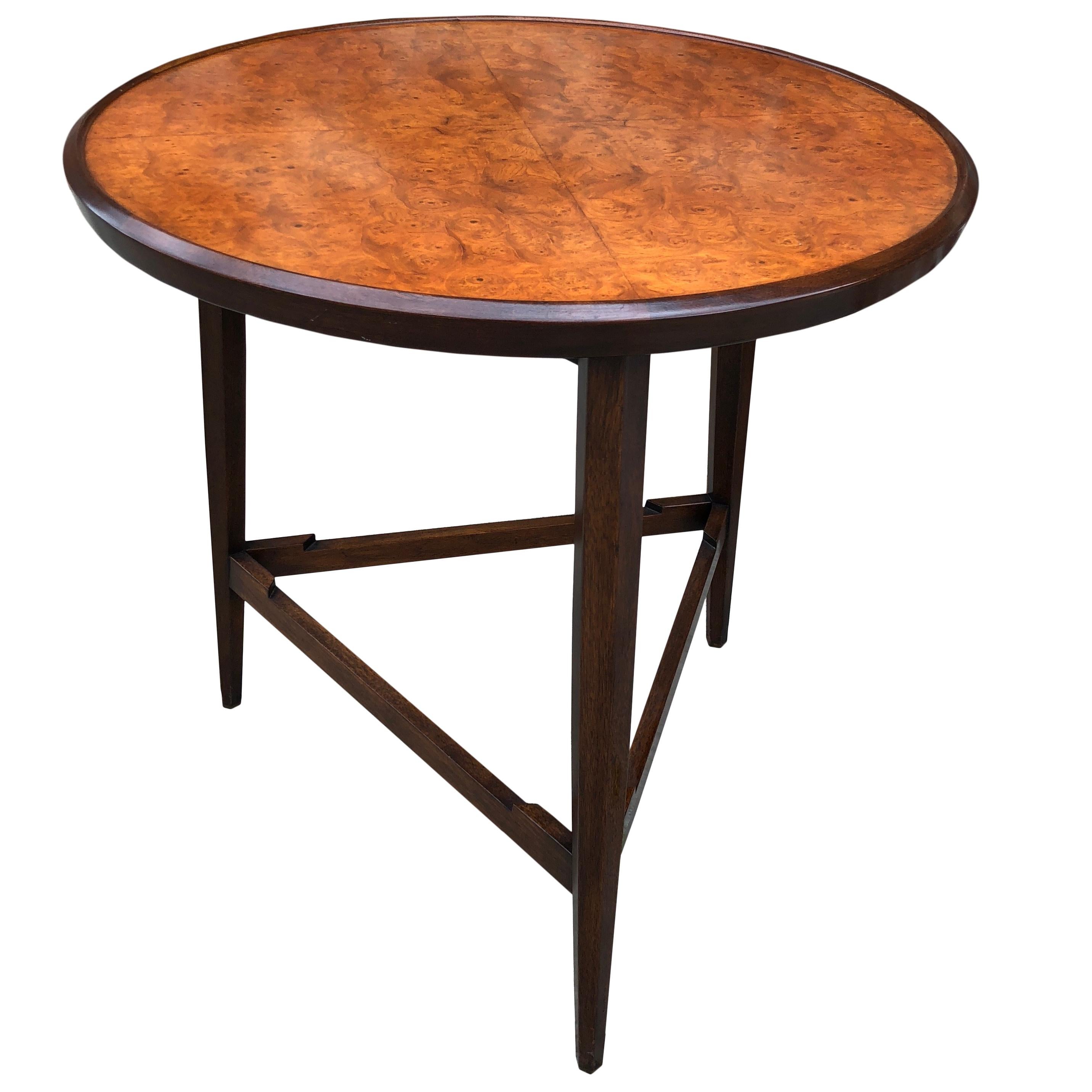 From the 1957 Janus line, this elegant side or snack table has a burl Carpathian elm top on dark stained mahogany tripod base. Dunbar gold metal tag to the underside.

Tray is 18