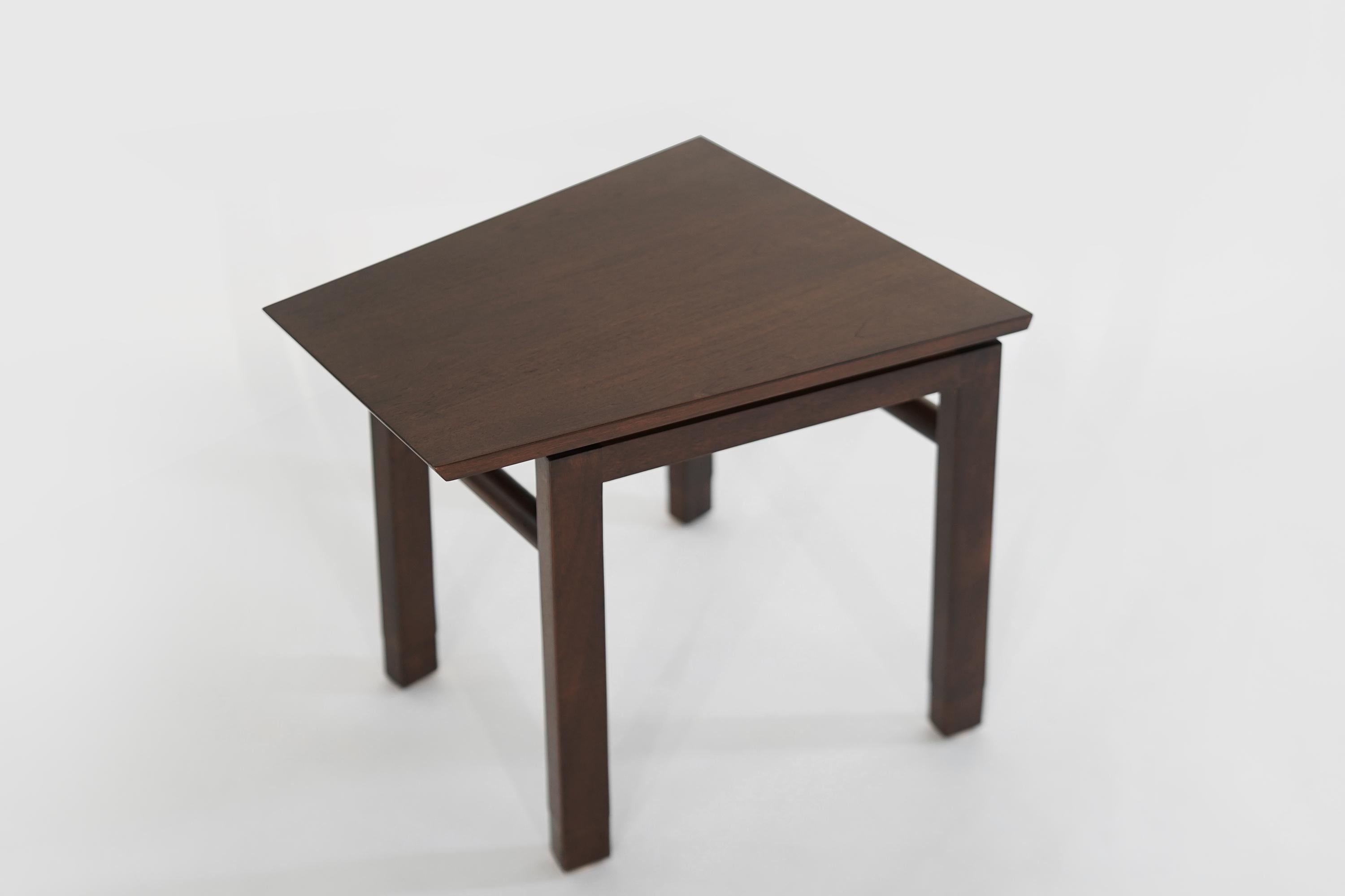 Occasional table designed by Edward Wormley for Dunbar circa 1950s. Mahogany with leather feet in newly restored condition.