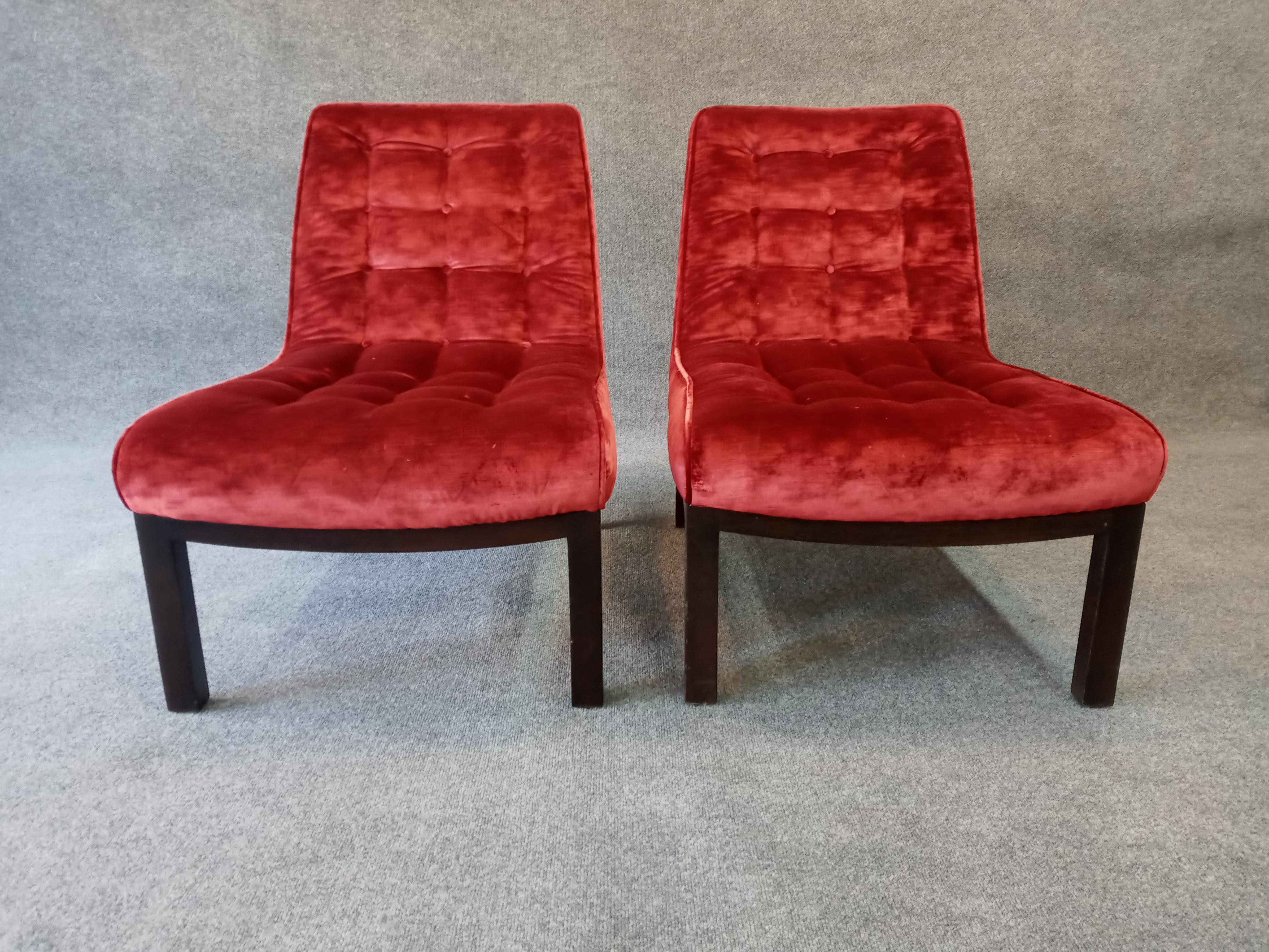 A sleek and comfortable pair of classic Wormley for Dunbar slipper chairs. Older restoration of mahogany legs and recovering of upholstery shows minor scuffs and scratches to bases and rub marks to high-quality fabric. Chairs are perfectly sturdy,