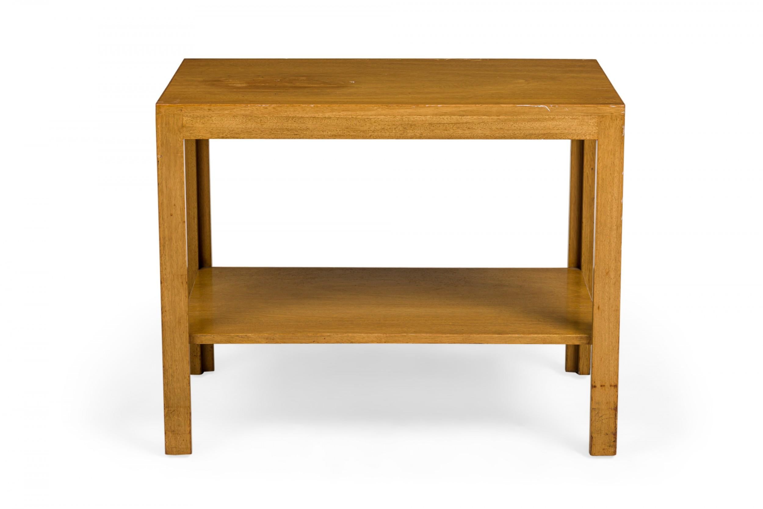 American Mid-Century Parsons-style end/side table with a wooden rectangular form with a lower stretcher shelf. (EDWARD WORMLEY FOR DUNBAR FURNITURE COMPANY).
 