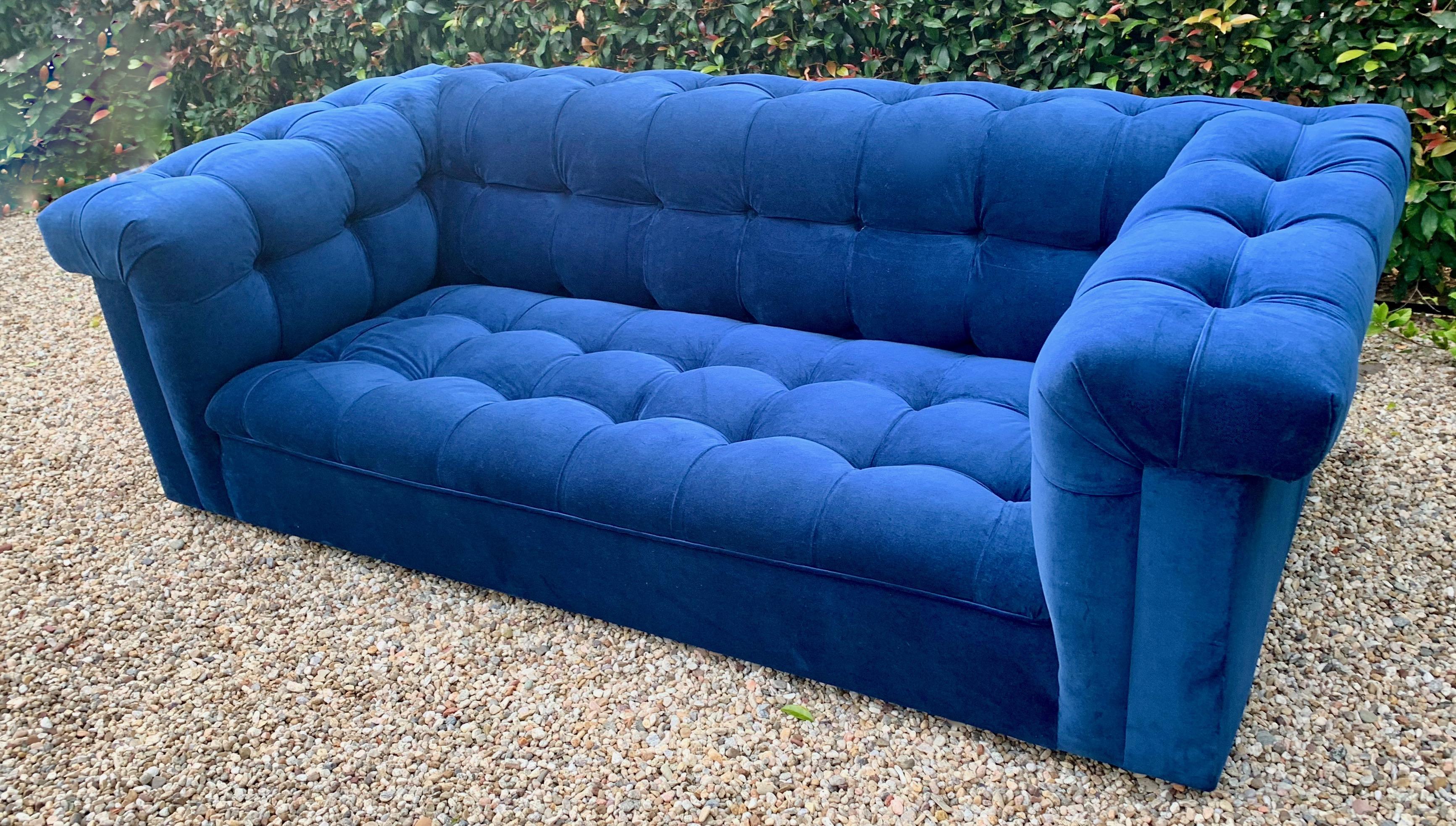Iconic Dunbar party sofa in cerulean tufted blue velvet, designed by Edward Wormley. Large enough for a wonderful statement. However, the perfect size for bedroom, smaller reading room, or the formal living space.