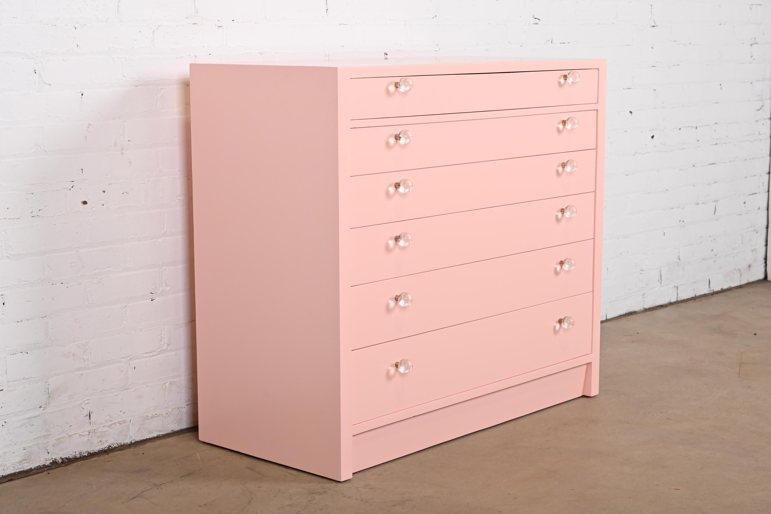 An exceptional Mid-Century Modern six-drawer dresser or chest of drawers

By Edward Wormley for Dunbar Furniture

USA, 1950s

Pink lacquered mahogany, with lucite and brass drawer pulls.

Measures: 38
