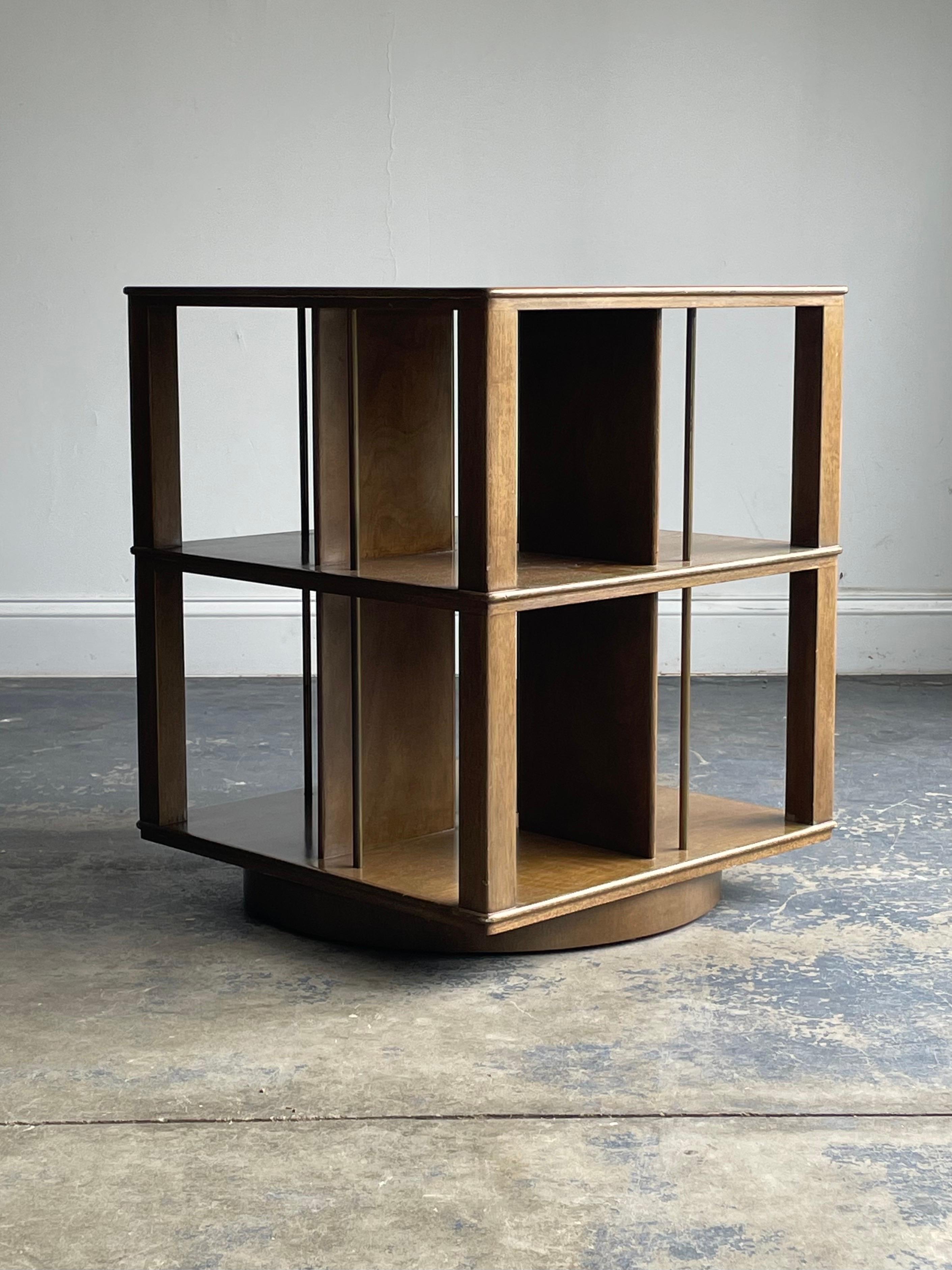 A rare revolving bookcase designed by Edward Wormley for Dunbar. Model no. 5405.

Listing is for one table, a second table is available in the same finish.

Would work well in a variety of interiors such as modern, mid century modern, contemporary,