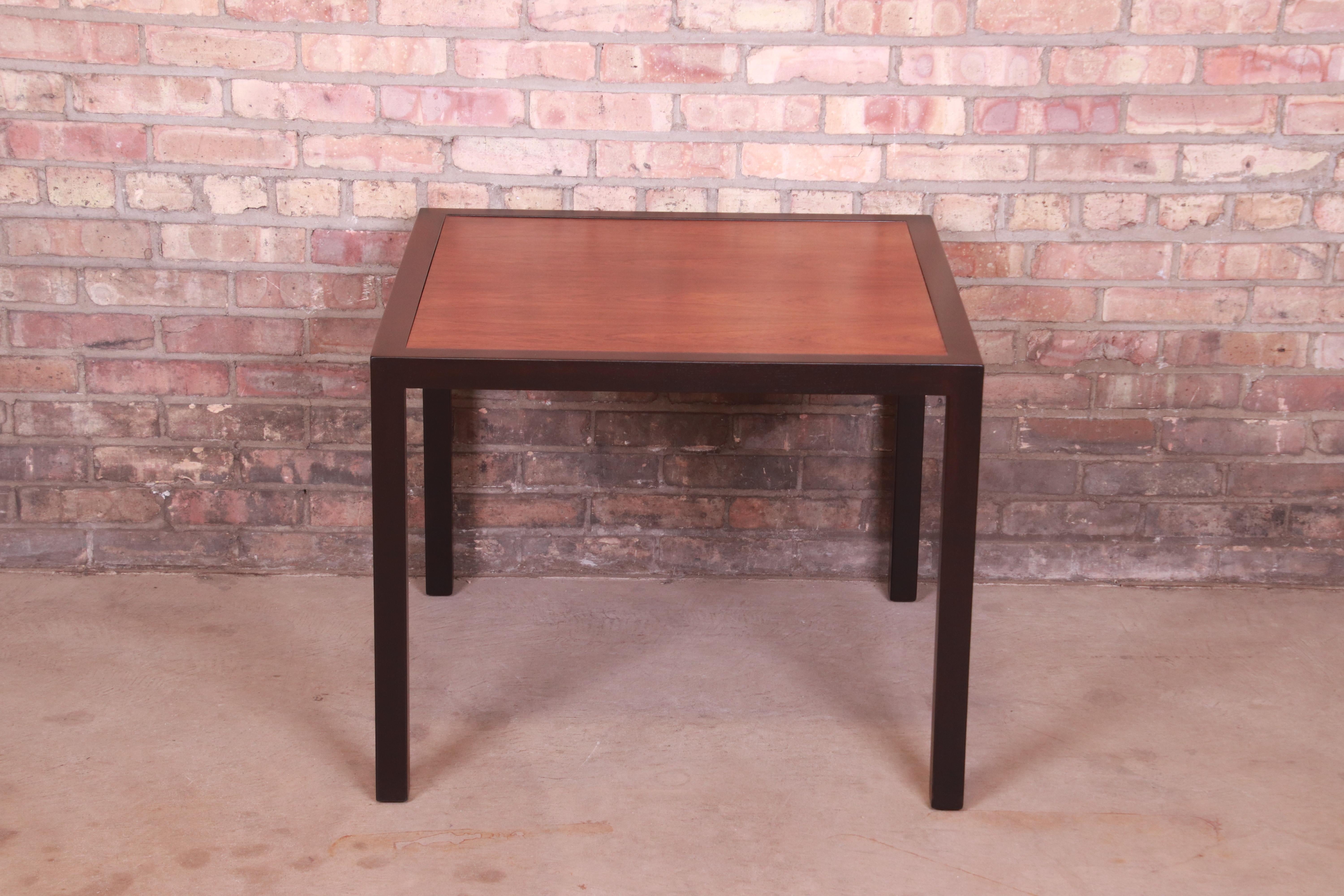 A gorgeous Mid-Century Modern cocktail table, occasional side table, or tea table

By Edward Wormley for Dunbar Furniture

USA, 1950s

Book-matched rosewood top, with ebonized banding and legs.

Measures: 29