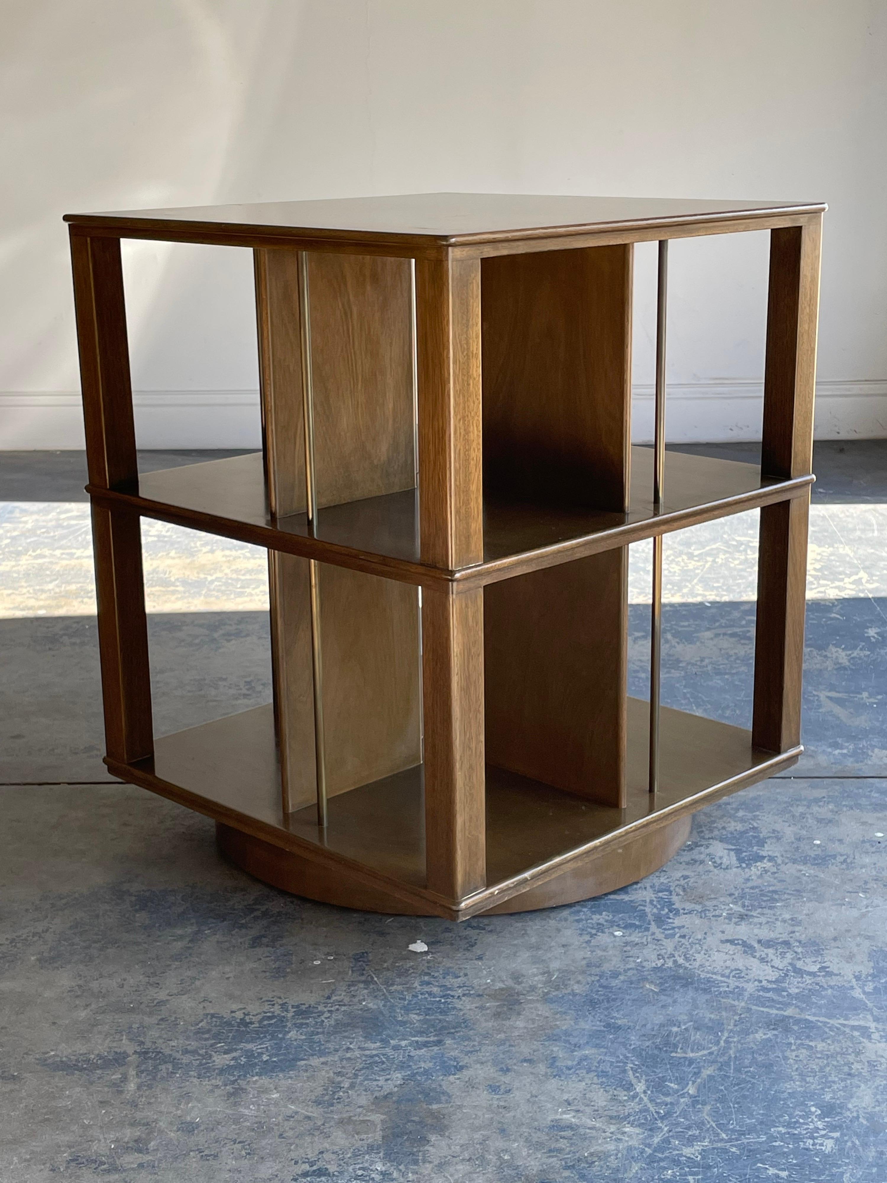 A rare revolving bookcase designed by Edward Wormley for Dunbar. Model no. 5405. 

Listing is for one table, a second table is available in the same finish. The other table is listed separately.

 Would work well in a variety of interiors such