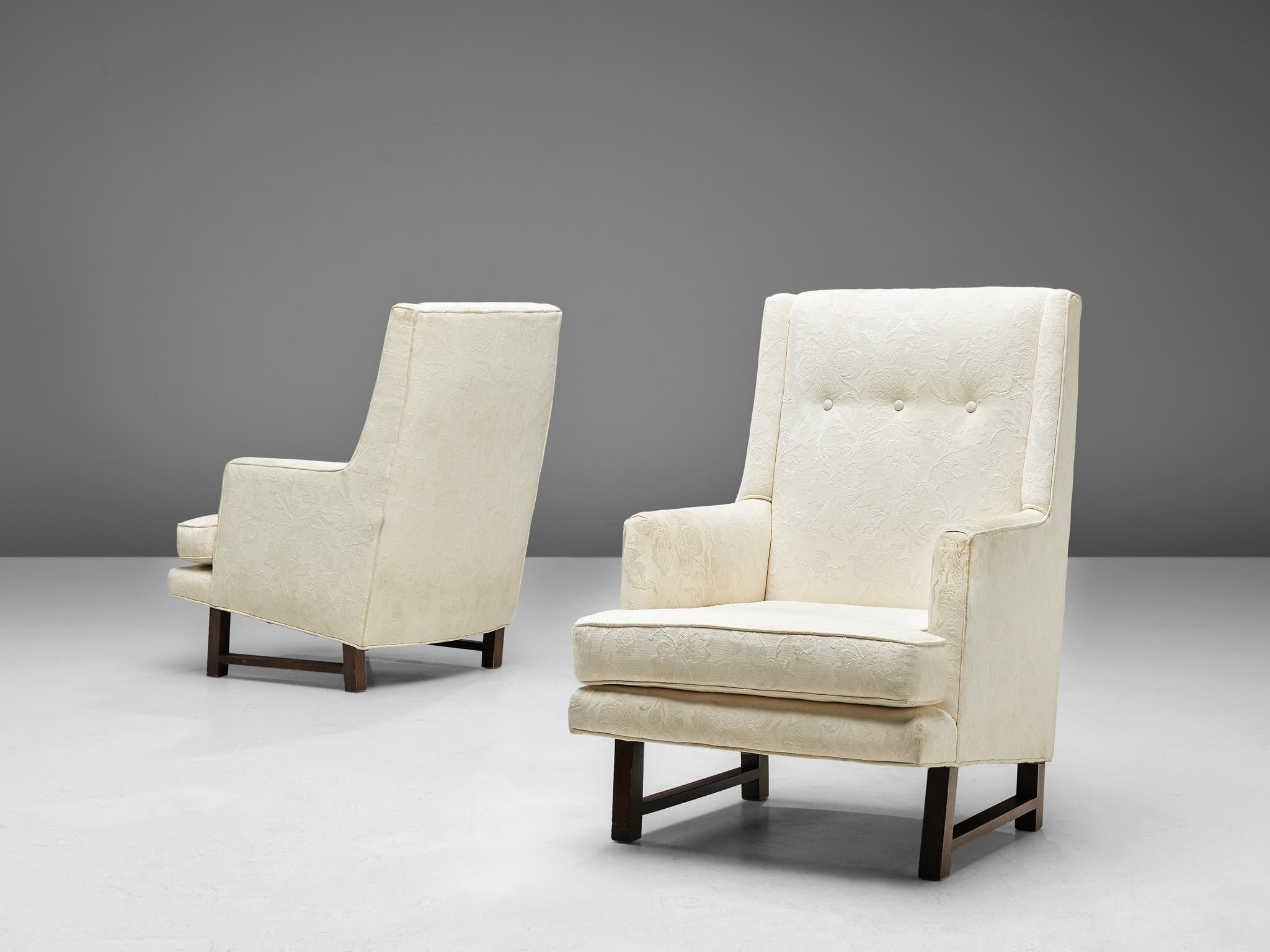 Edward Wormley for Dunbar, pair of lounge chairs, fabric and mahogany, United States, 1950s

These comfortable high back chairs are designed by Edward Wormley in the 1950s. It has straight lines and a basic wooden frame, yet some classic elements