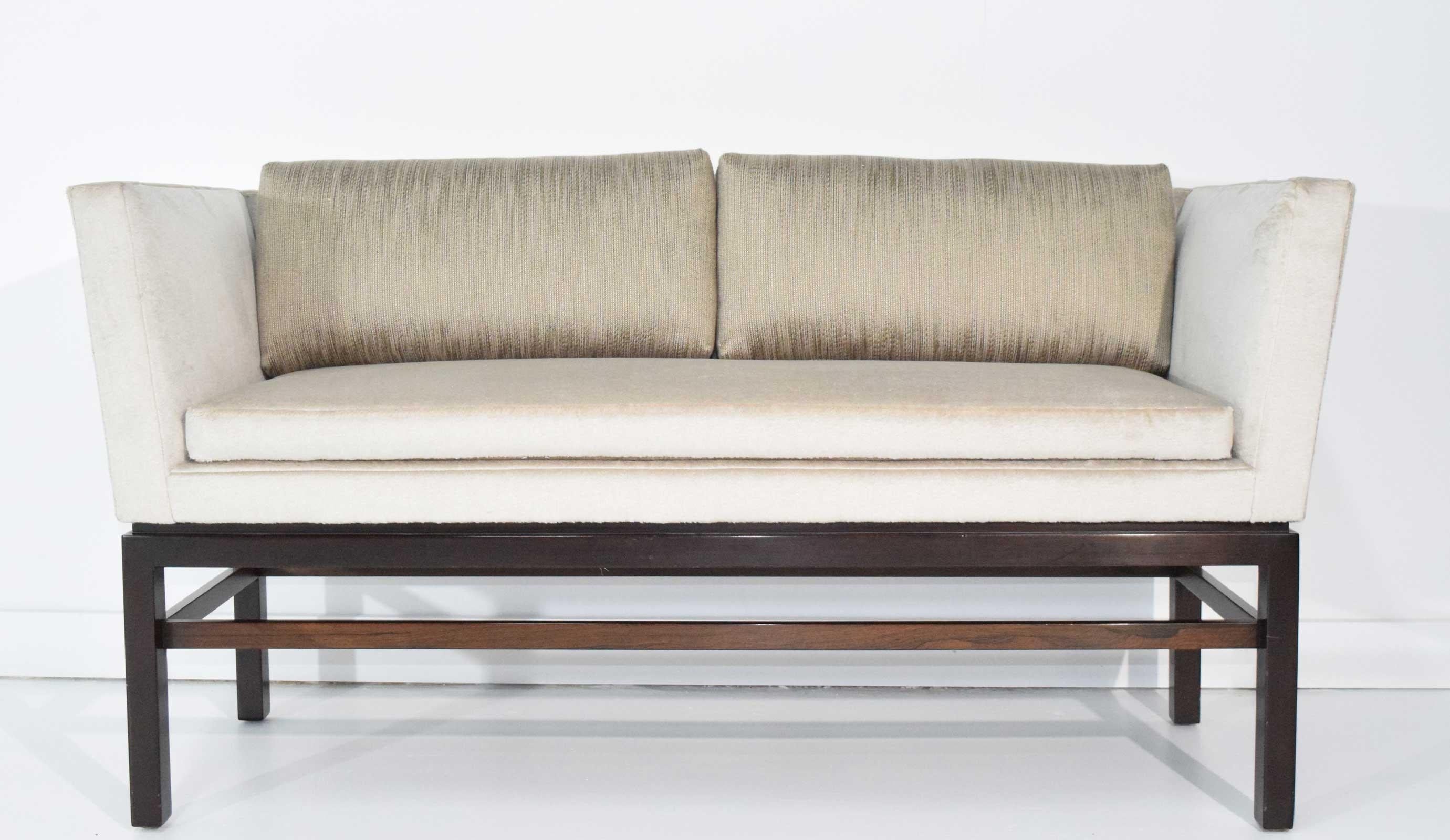 Settee has a Holly Hunt silk and camel hair fabric with a mahogany base.
