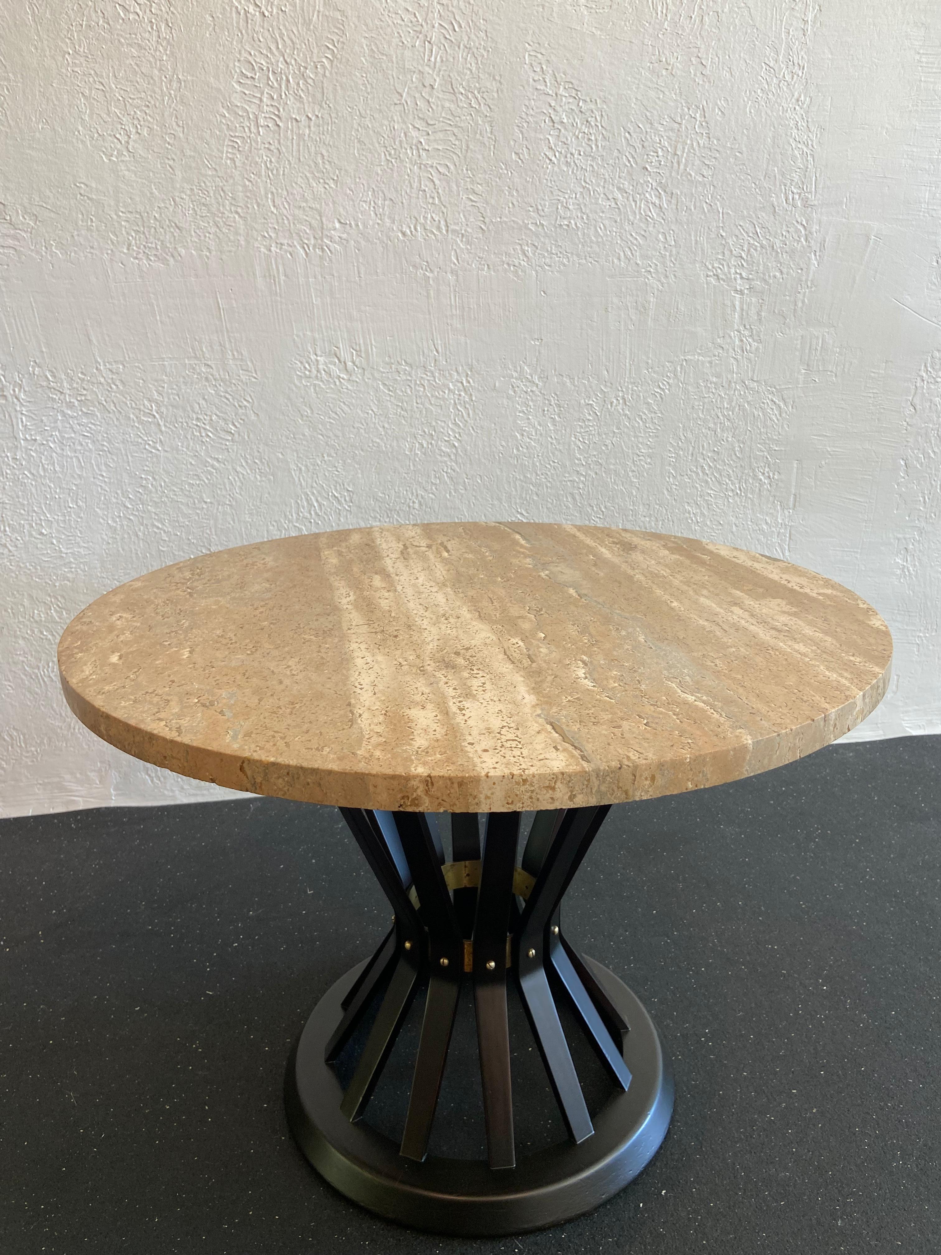 Edward Wormley for Dunbar sheaf of wheat occasional table. Signed. Ebonized frame with travertine stone top. Stone in very good condition, frame recently refinished (please refer to photos).

Would work well in a variety of interiors such as