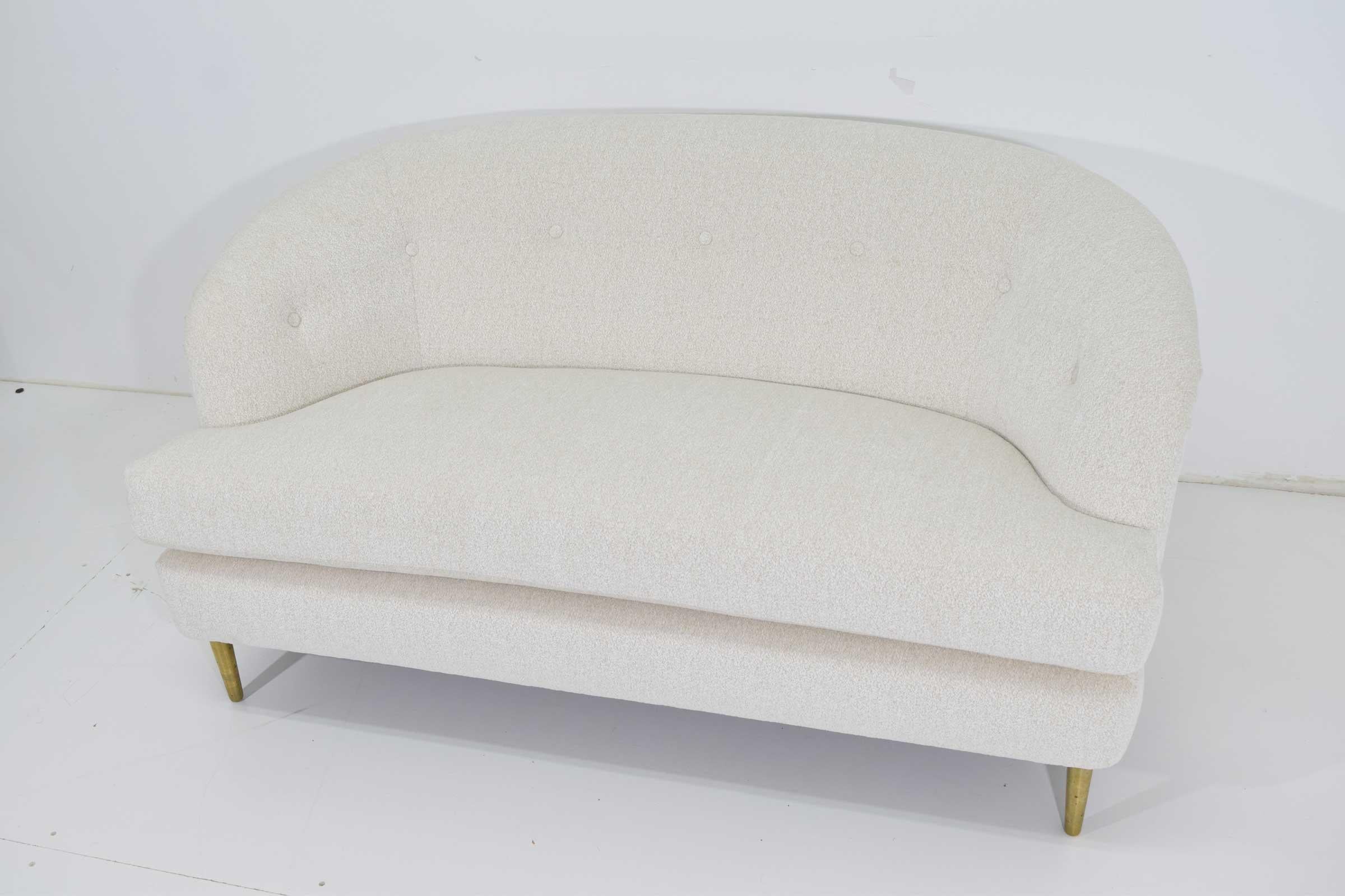Beautifully restored Dunbar short sofa with brass legs. New upholstery by Larsen.