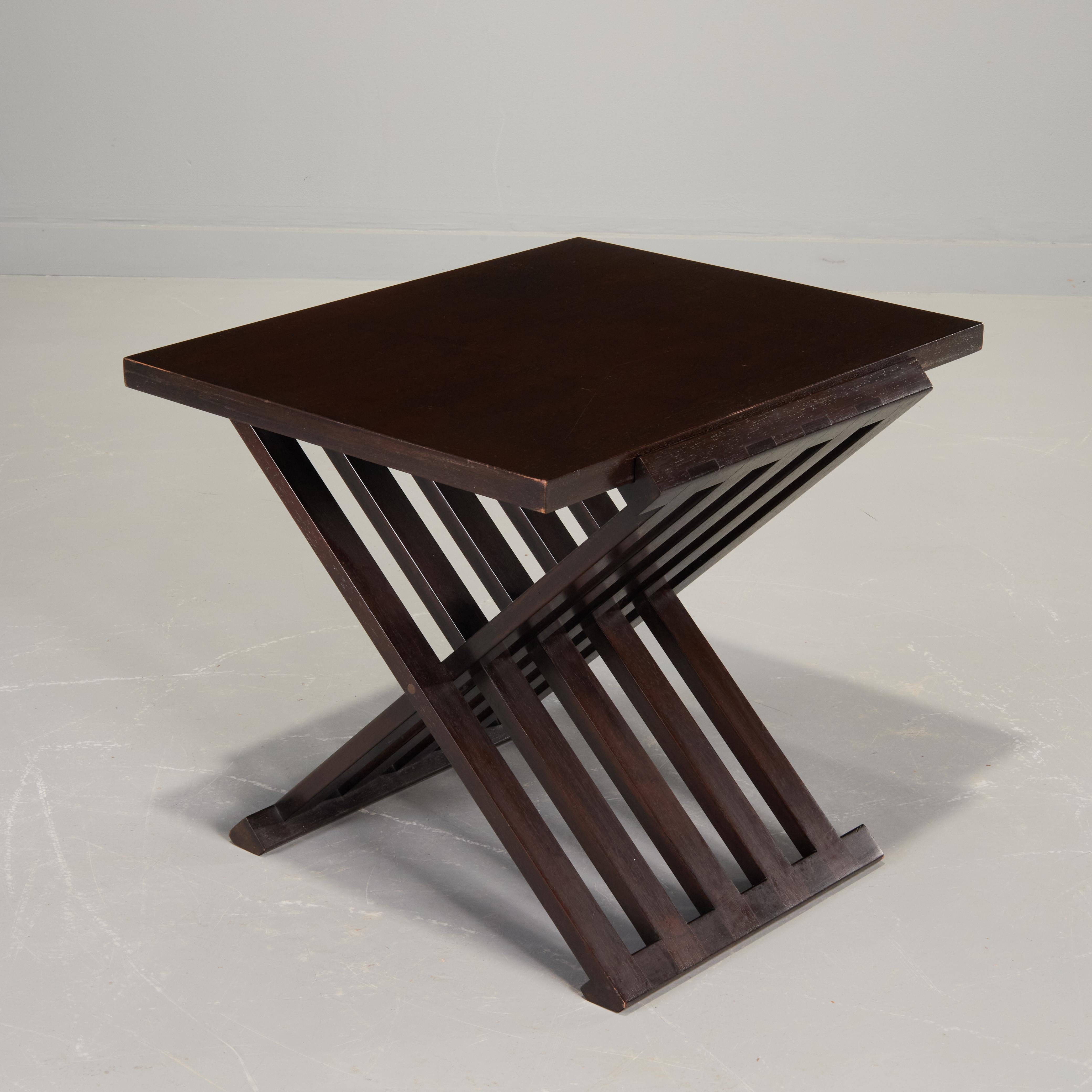 Occasional table by Edward Wormley for Dunbar, model 5425. Rosewood and Walnut  folding x-base with removable mahogany tray top. Labeled with Dunbar gold metal tag