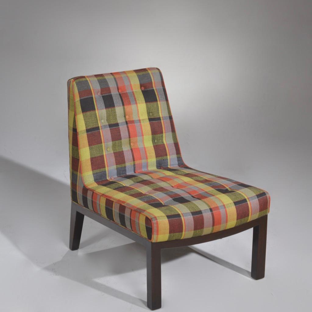 Comfortable armless lounge slipper chair by Edward Wormley for Dunbar in beautiful plaid upholstery. A true collectors piece with no modifications and in excellent vintage condition.
 
 