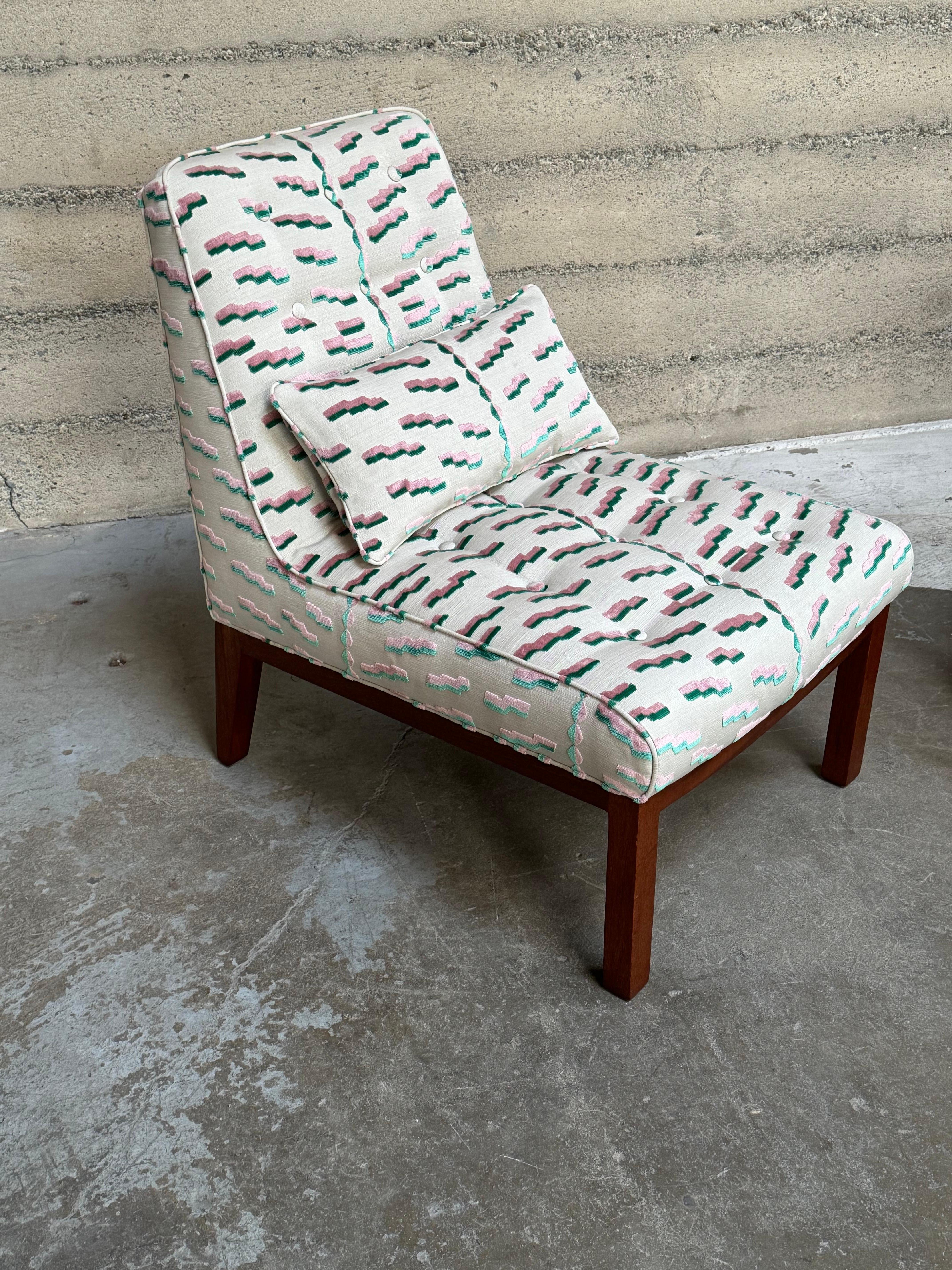 Classic slipper lounge chairs designed by Edward Wormley for Dunbar Furniture. These chairs are iconic pieces of mid-century modern design, and are updated with 