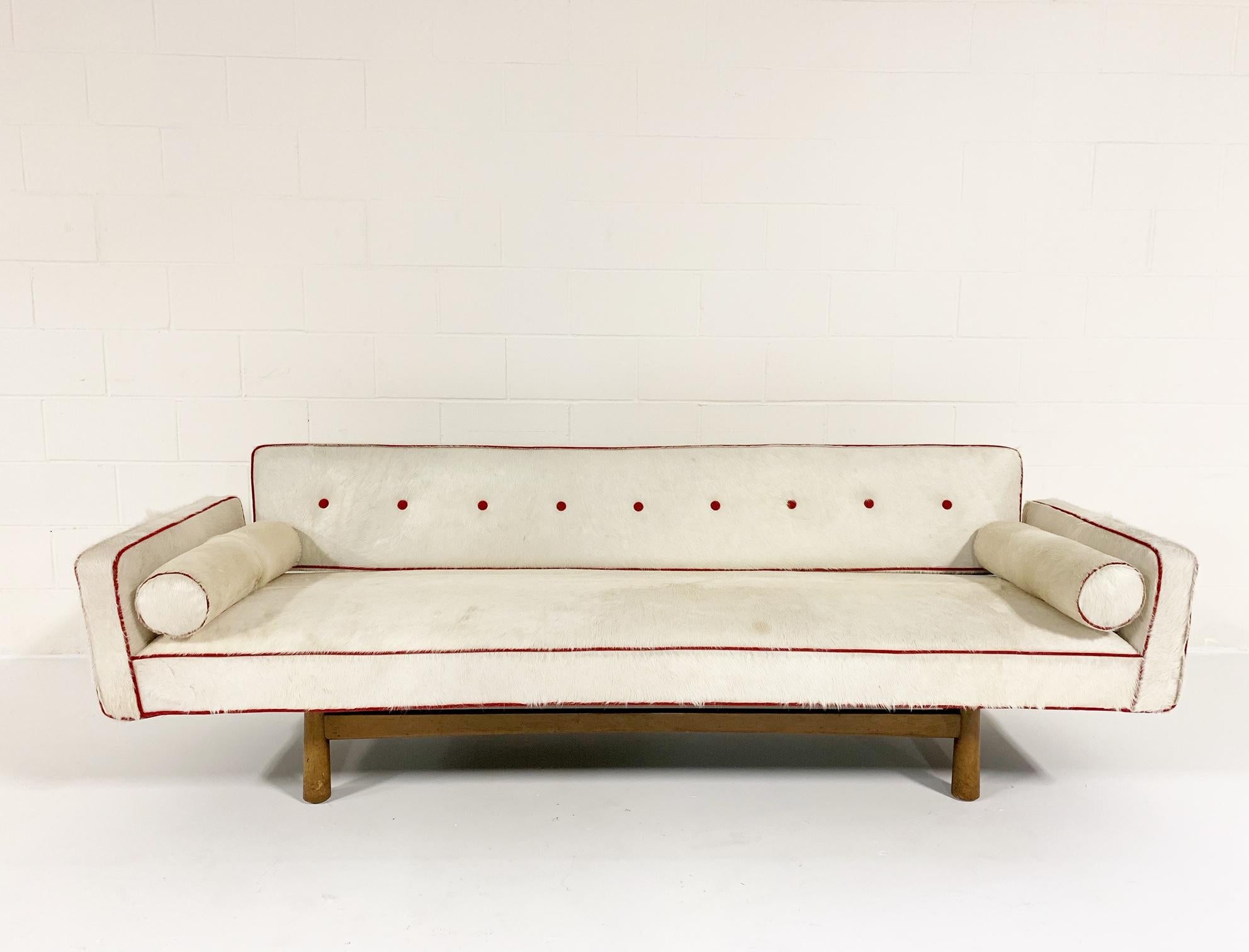 Vintage Edward Wormley for Dunbar Model 5316 Sofa Restored in Brazilian Cowhide with Loro Piana Red Cashmere Welting

A Calvin Klein western shirt inspired the look of this one-of-a-kind, vintage 1953 Edward Wormley Sofa. The sofa was masterfully