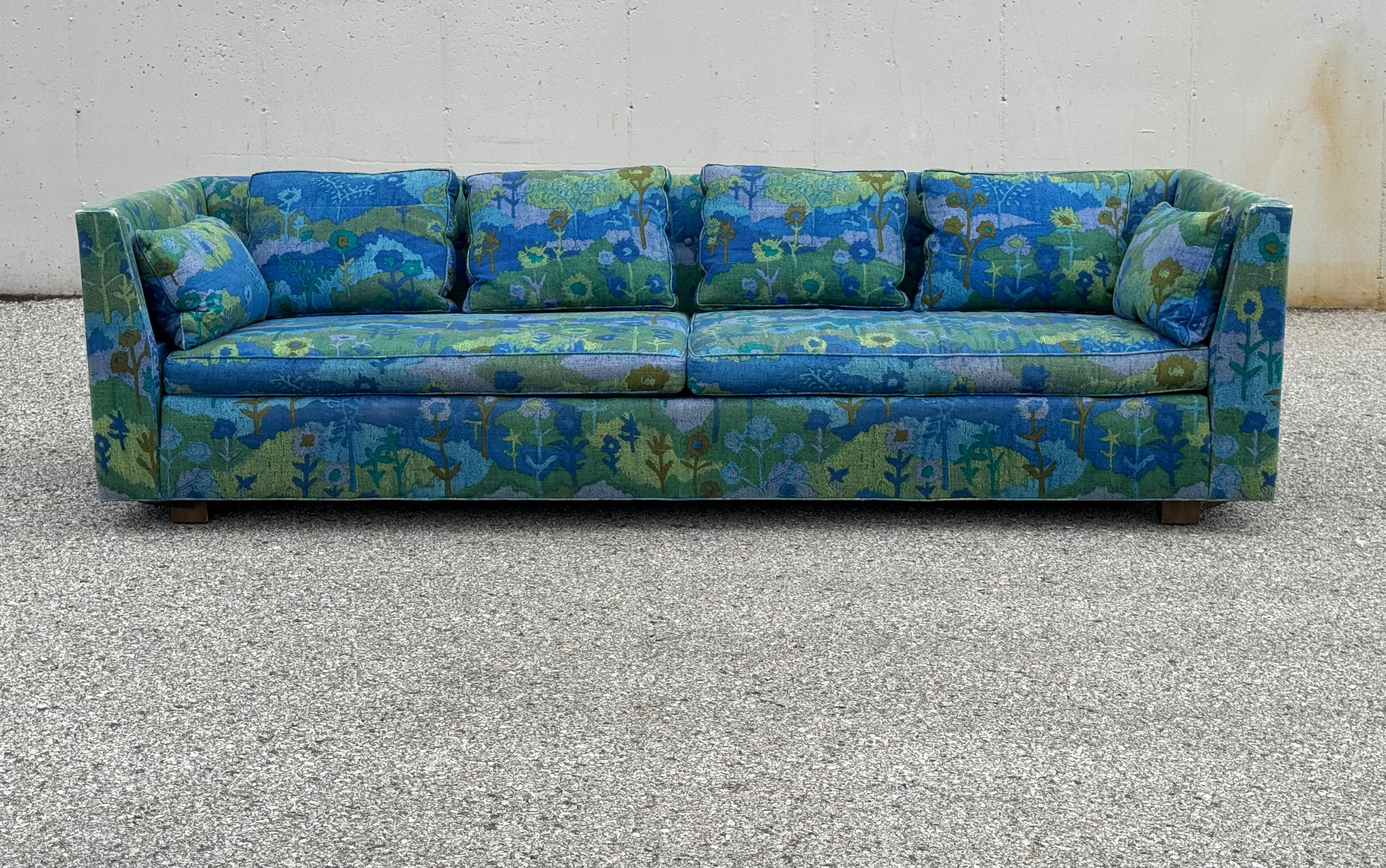 Classic mid-century modern sofa designed by Edward Wormley from his 1958 Dunbar - Conversation Pieces Collection, this sofa model #261 still has its original Jack Lenor Larsen colorful fabric. The sofa has down back cushion, foam seat, sits on