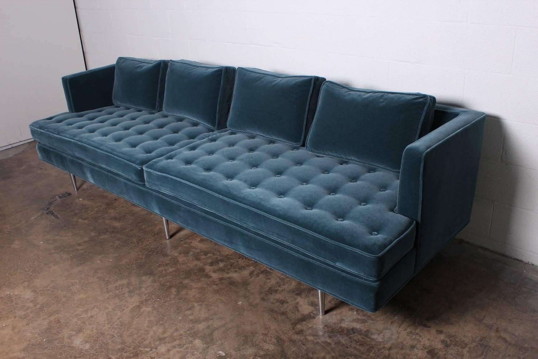 A Classic sofa design by Edward Wormley for Dunbar with polished nickel legs and fully restored in mohair upholstery with down back pillows.