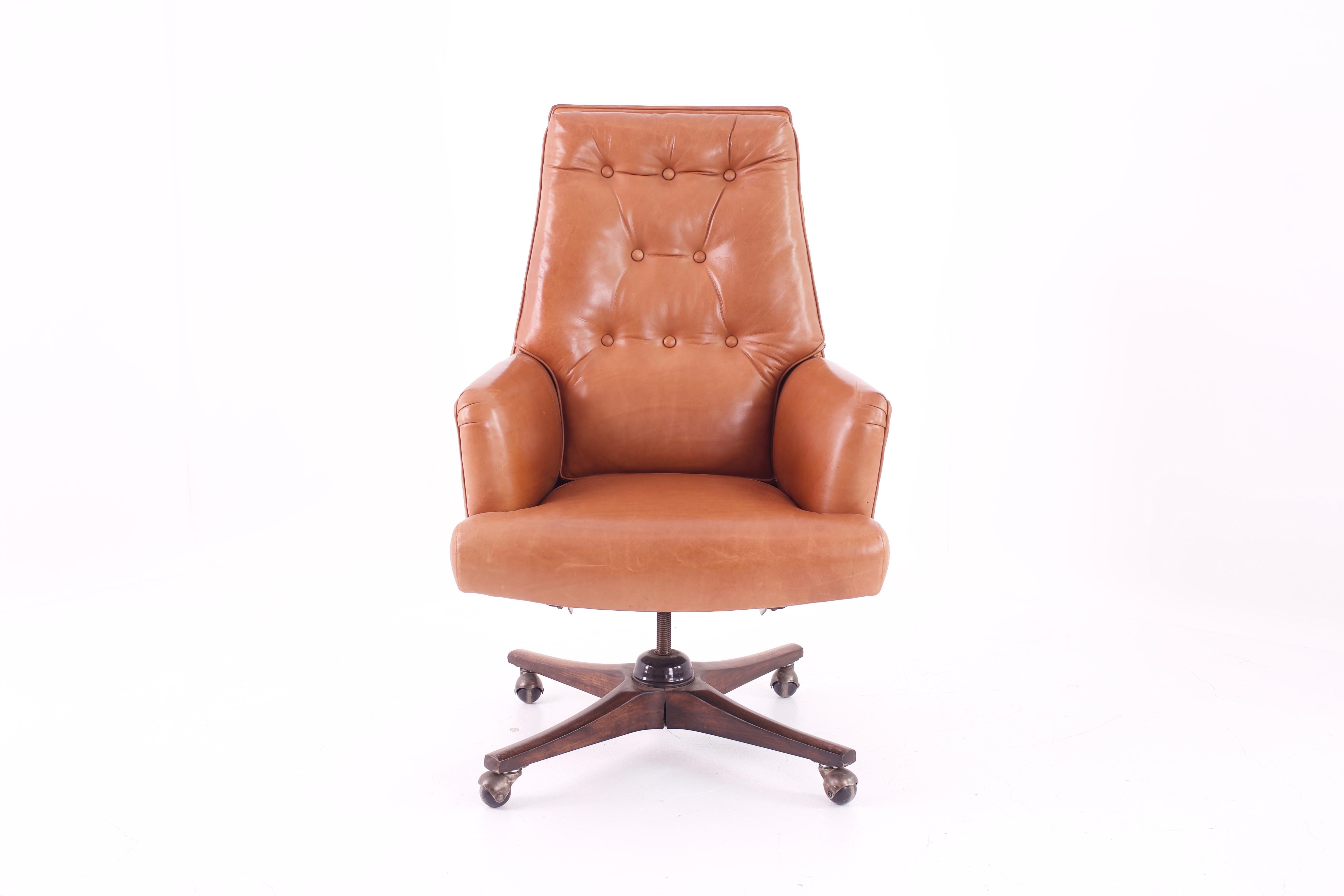 Edward Wormley for Dunbar style Mid Century leather orange desk chair
Chair measures: 27 wide x 25 deep x 44 high with a seat height of 19 inches
This price includes getting this piece in what we call restored vintage condition. Upon purchase it is