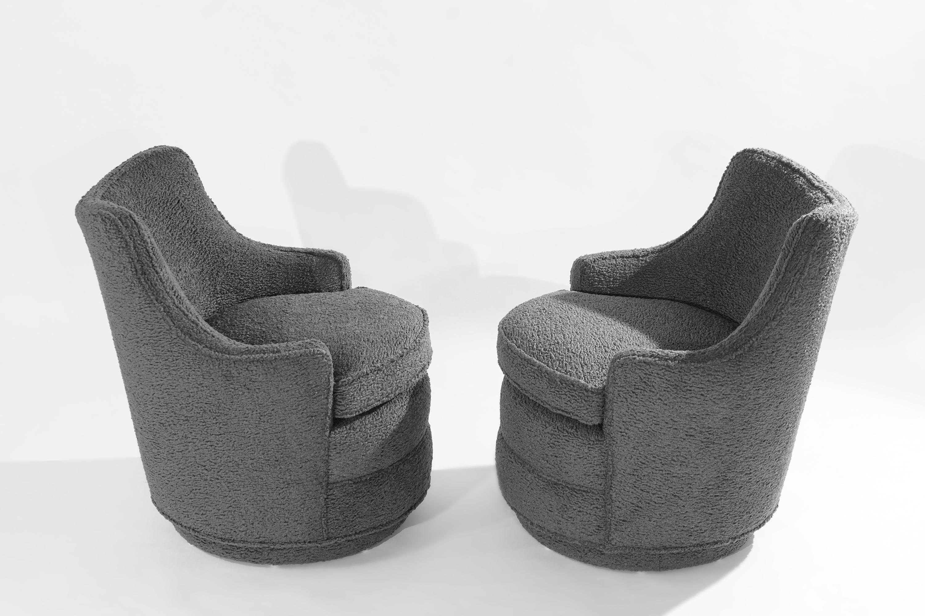 Pair of swivel chairs designed by Edward Wormley for Dunbar circa 1950-1959. Featuring sloping curves, newly upholstered in grey 