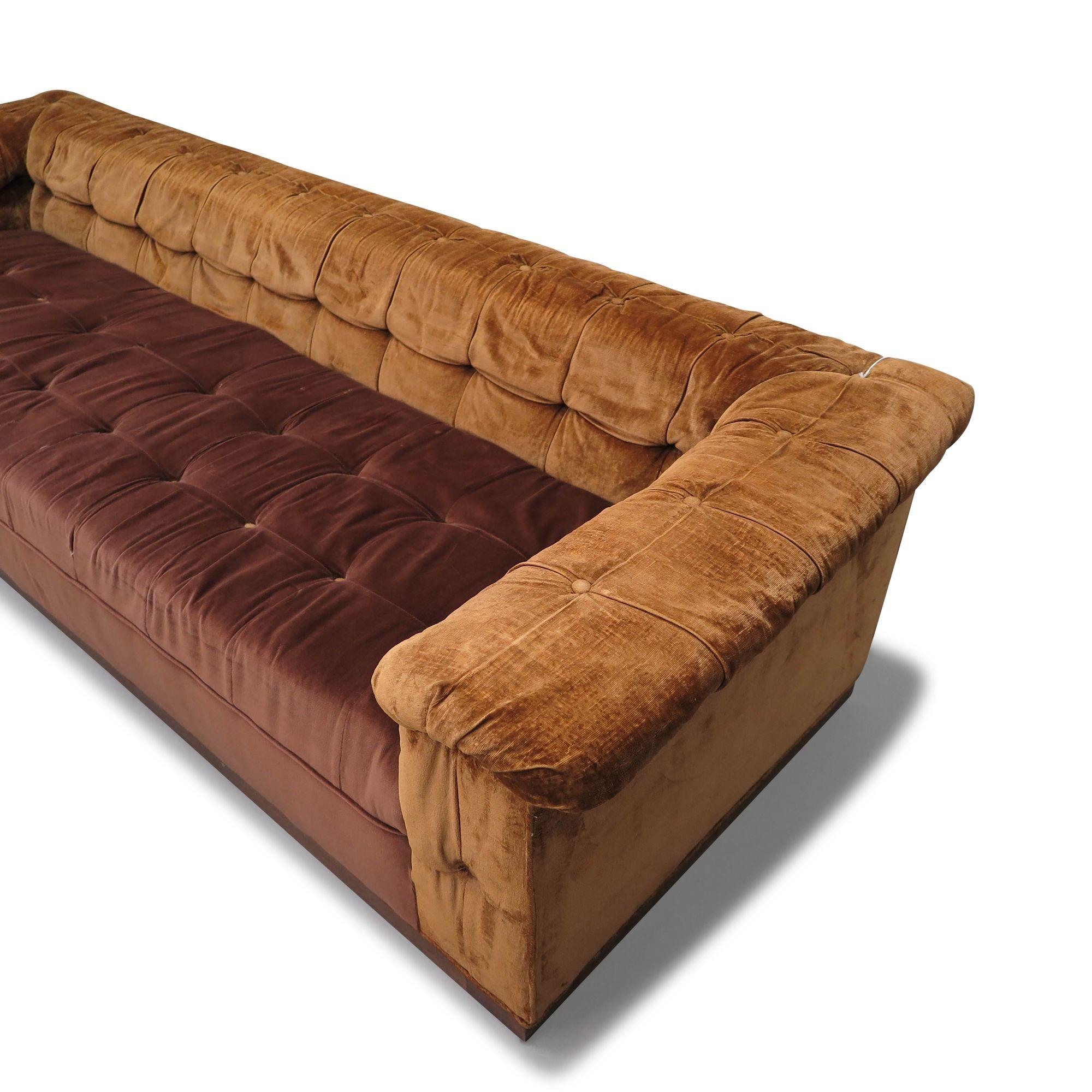 Mid-century sofa designed by Edward Wormley for Dunbar, Party sofa, Model 5407, United States, 1950. Crafted with a solid wood frame and inner spring seats, this sofa is upholstered in its original brown velvet fabric and supported by a solid plinth