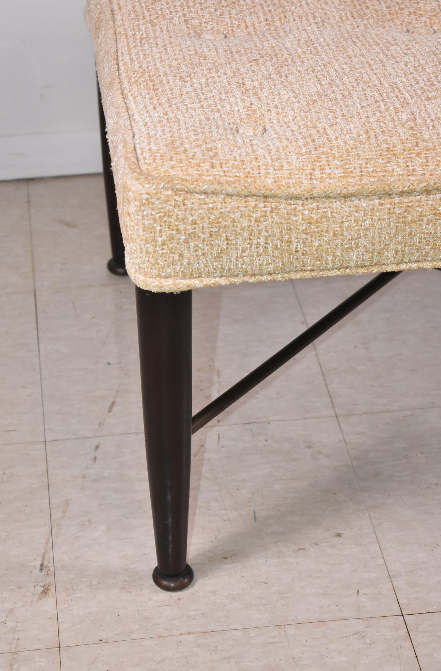 Classic Edward Wormley Thebes stool from the 1950's by Dunbar with a fabric seat and brass stretcher. The seat has the original fabric and may need to be recovered. 24