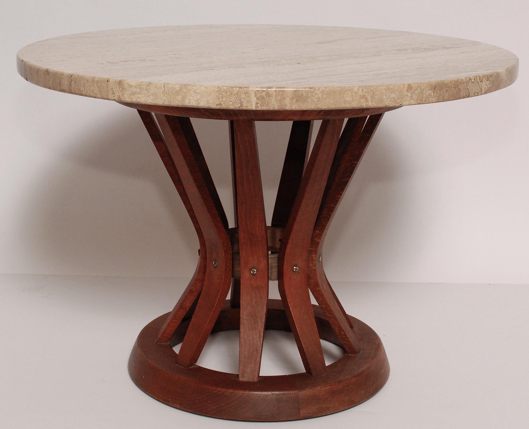 Perfect little side or drinks table with a cream color marble top and a rich oak wood base by Edward Wormley for Dunbar.
The right touch of any midcentury interior.