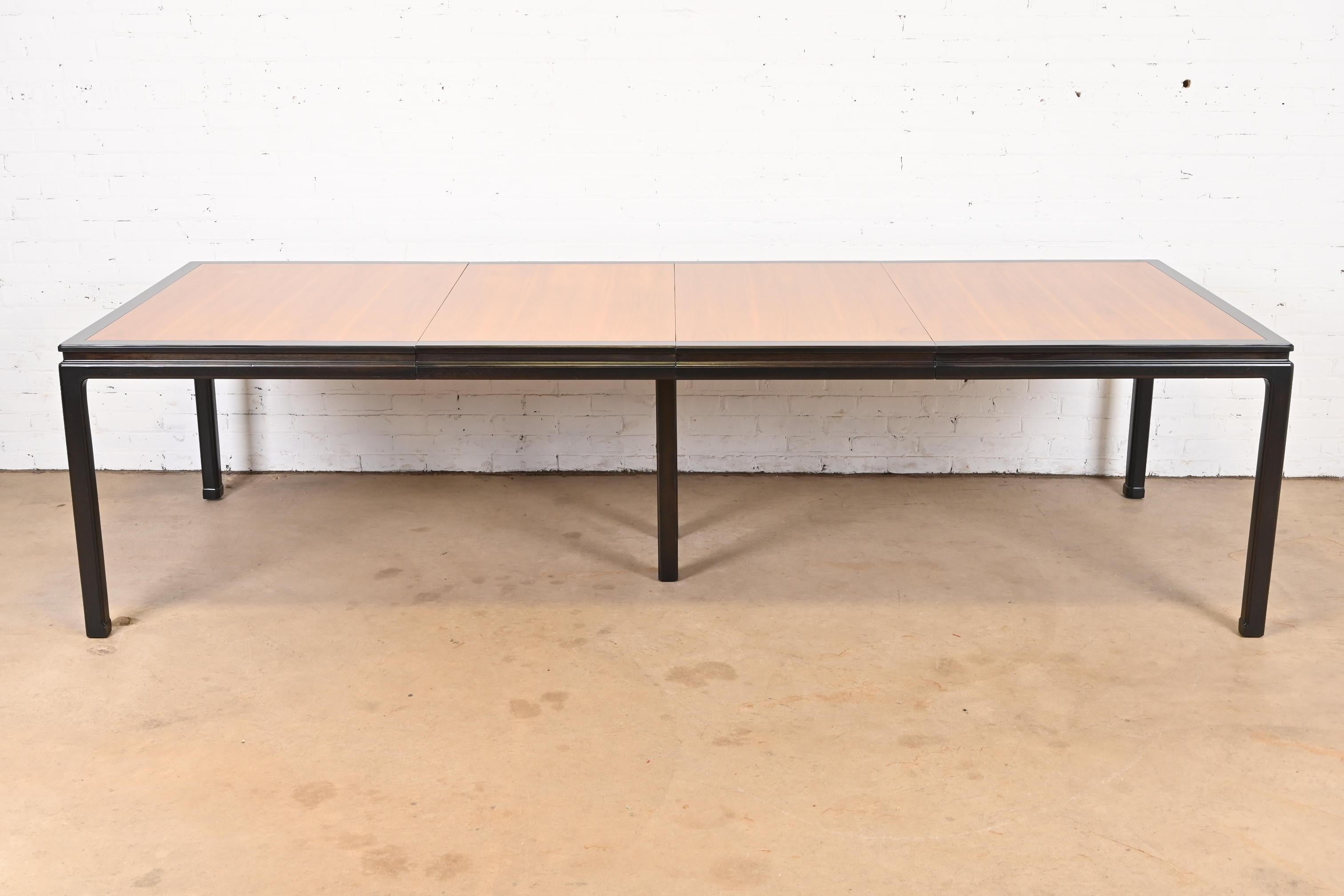 An exceptional Mid-Century Modern extension dining table

By Edward Wormley for Dunbar Furniture

USA, 1950s

Gorgeous book-matched walnut top, with ebonized walnut banding and legs.

Measures: 66