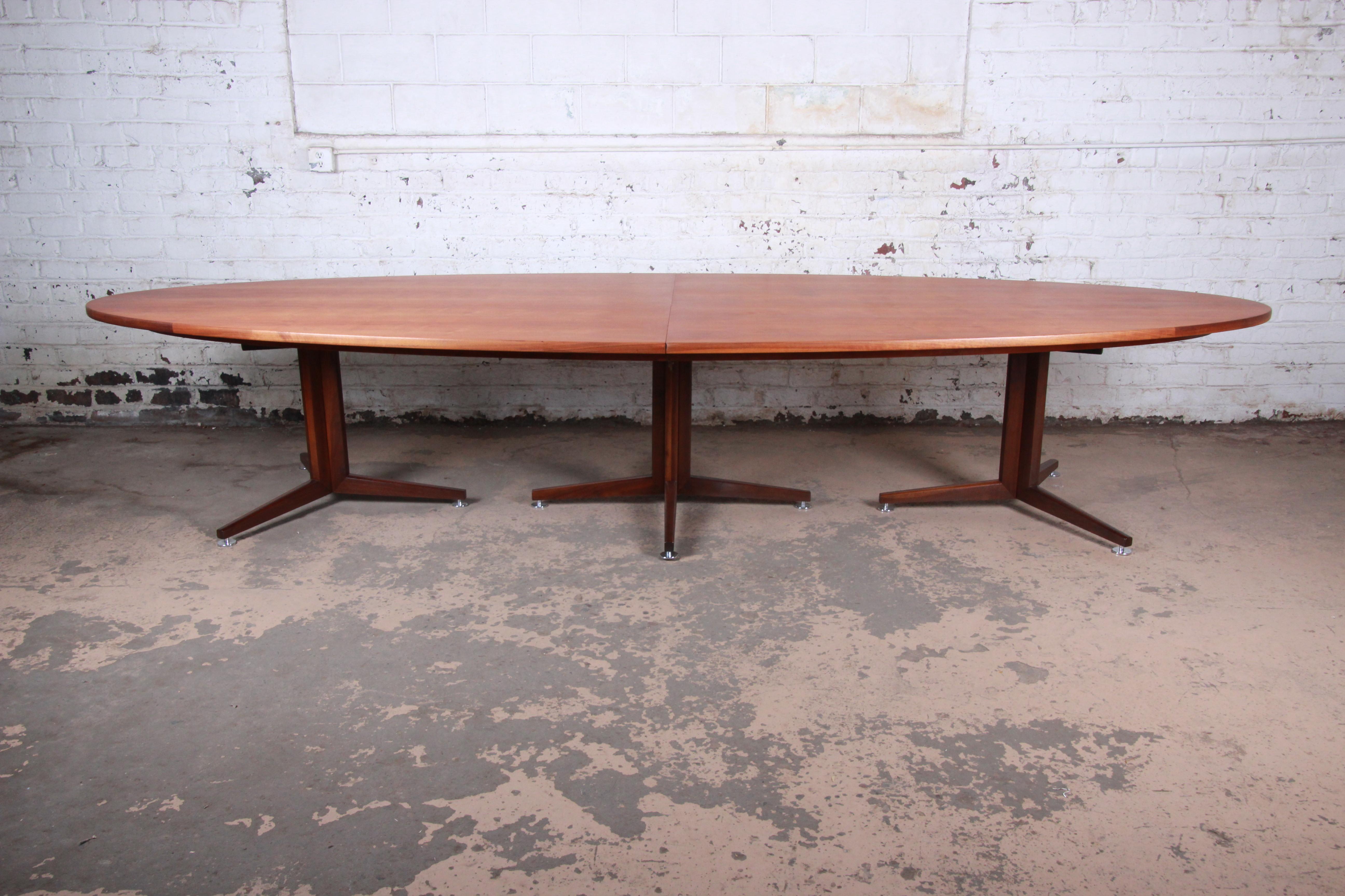 An extremely rare and exceptional Mid-Century Modern custom 14-foot walnut conference or dining table

Designed by Edward Wormley for Dunbar Furniture

USA, 1960s

Figured walnut top + solid walnut pedestals + chrome feet

Measures: 168