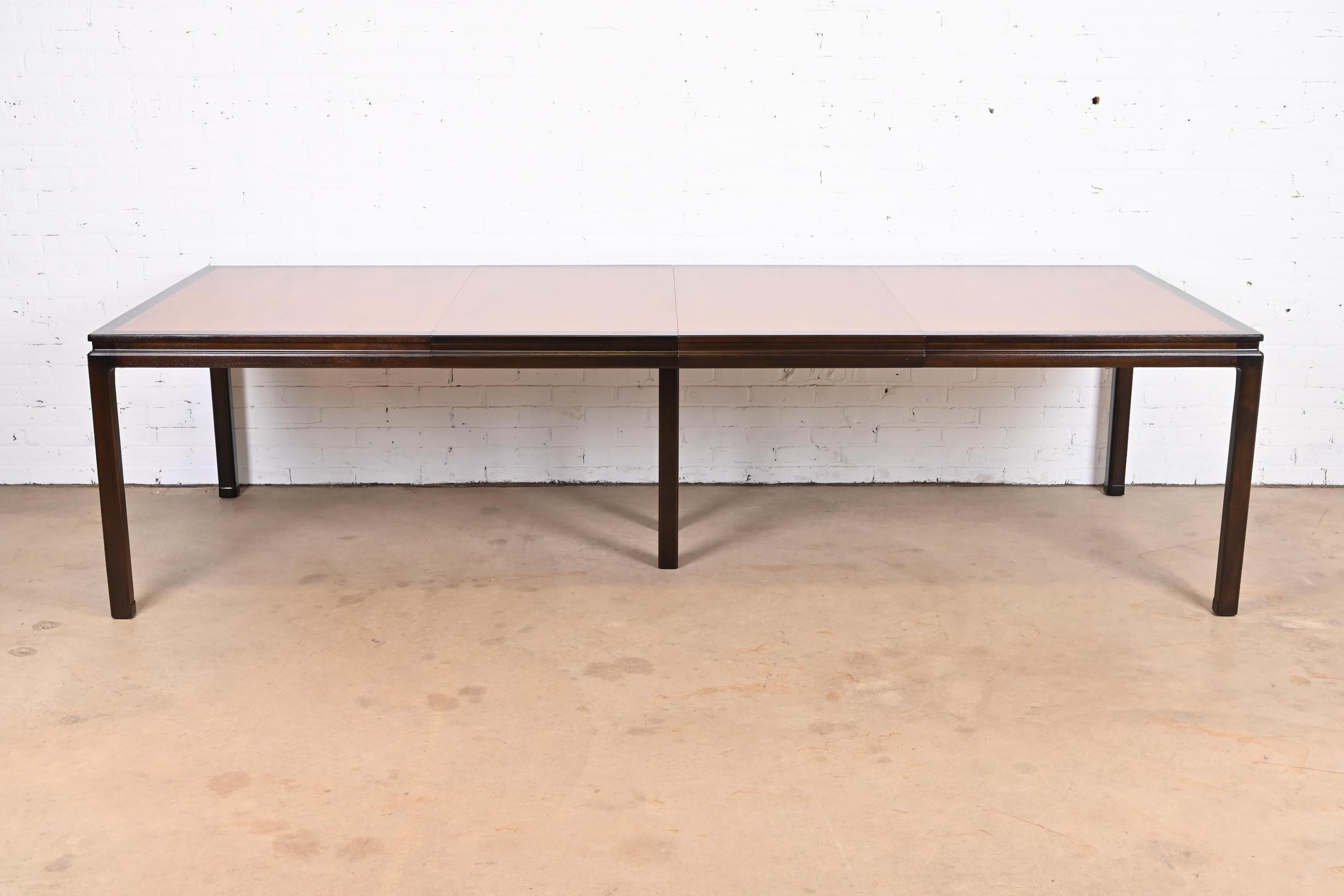 An exceptional Mid-Century Modern extension dining table

By Edward Wormley for Dunbar Furniture

USA, 1950s

Book-matched walnut top, with ebonized walnut banding and legs.

Measures: 66.25