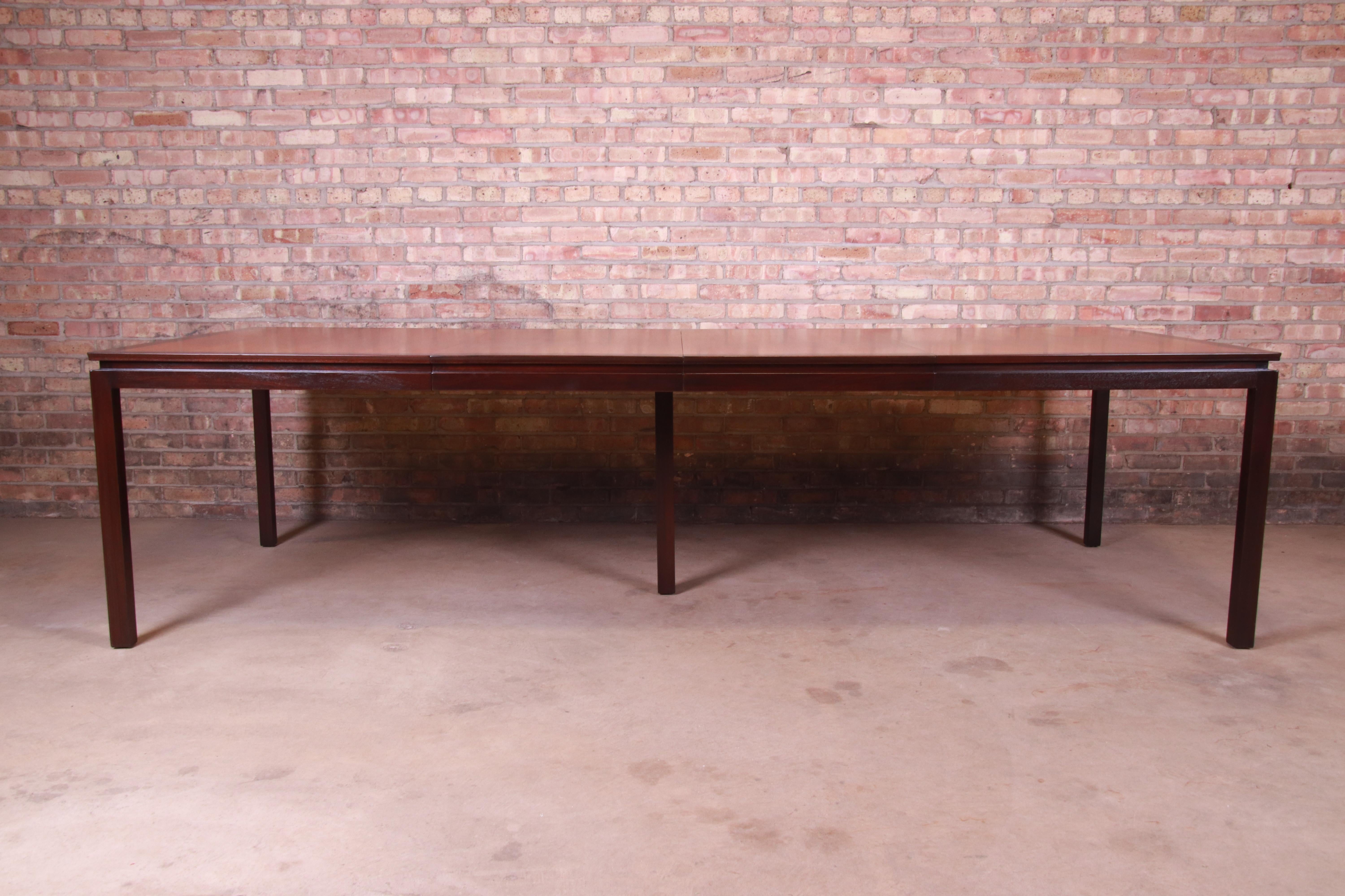 An exceptional Mid-Century Modern extension dining table

By Edward Wormley for Dunbar Furniture

USA, 1950s

Bookmatched walnut top, with dark walnut banding and legs.

Measures: 66.25