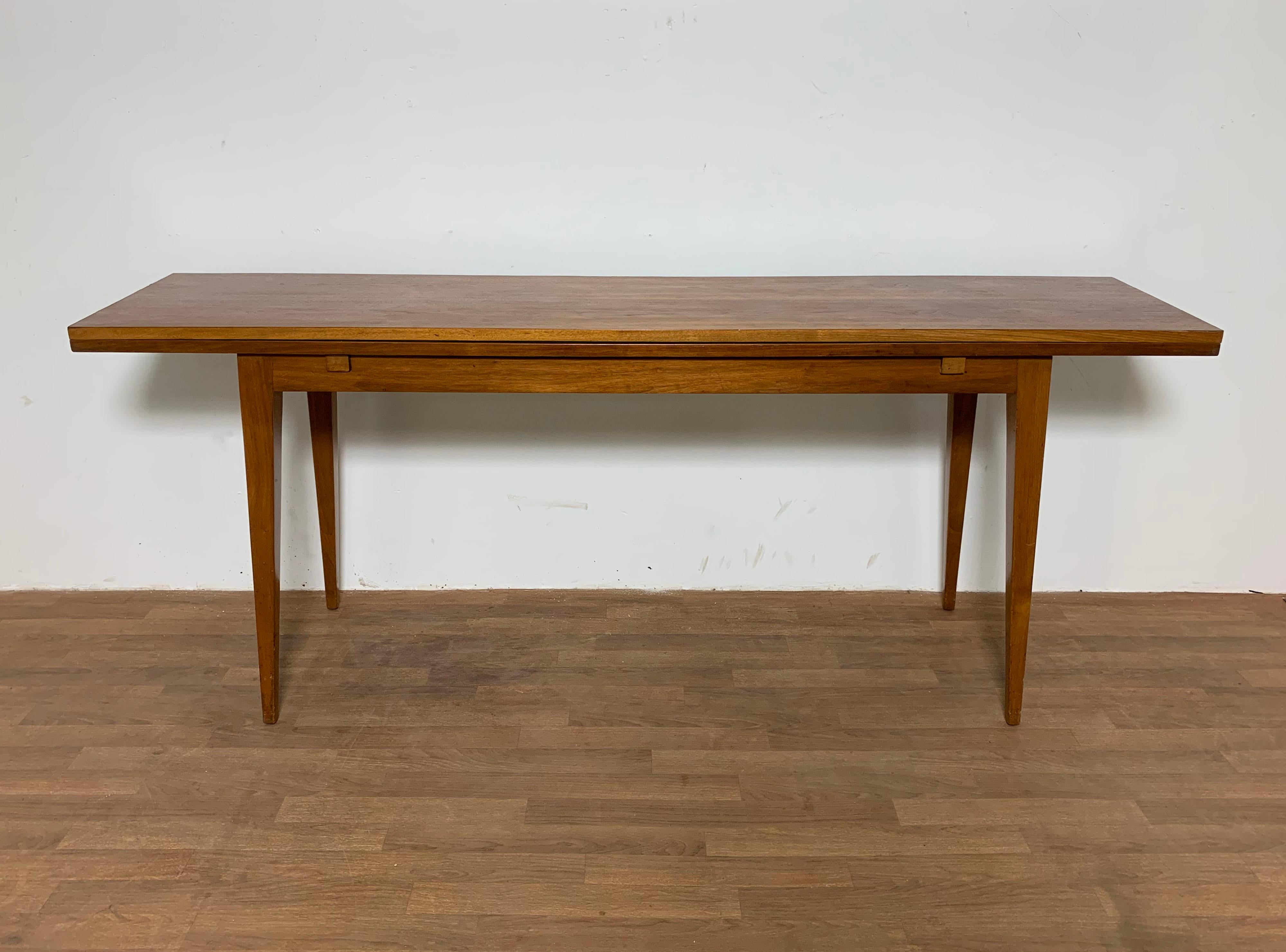 Walnut flip top console table by Edward Wormley for Dunbar, ca. 1950s.
Measures 72