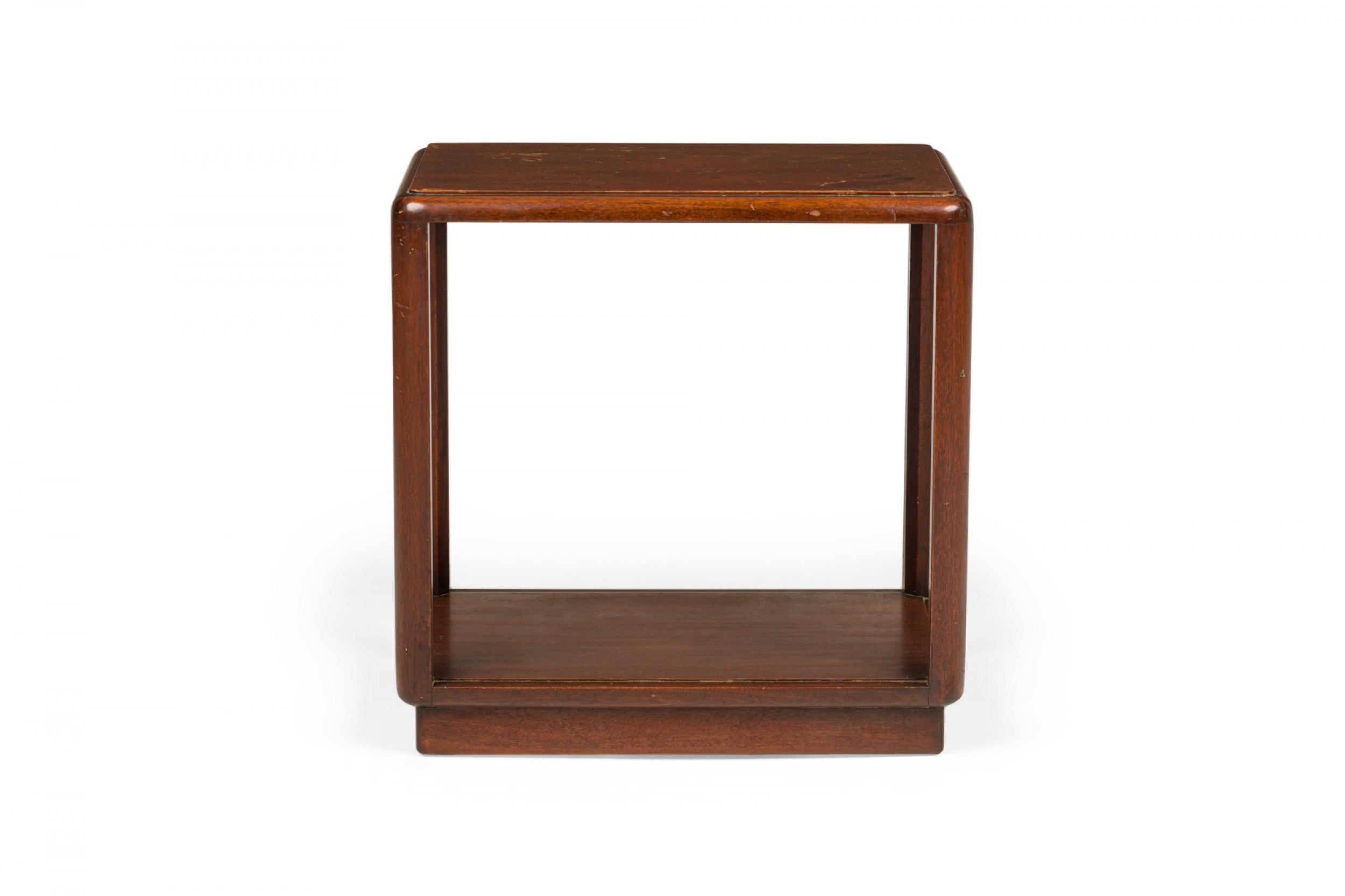 American Mid-Century wooden end / side tables with a rectangular top with rounded corners, a pedestal base, and an open frame design. (EDWARD WORMLEY FOR DUNBAR FURNITURE COMPANY)(Similar tables: DUF0751, DUF0752, DUF0753, DUF0754)