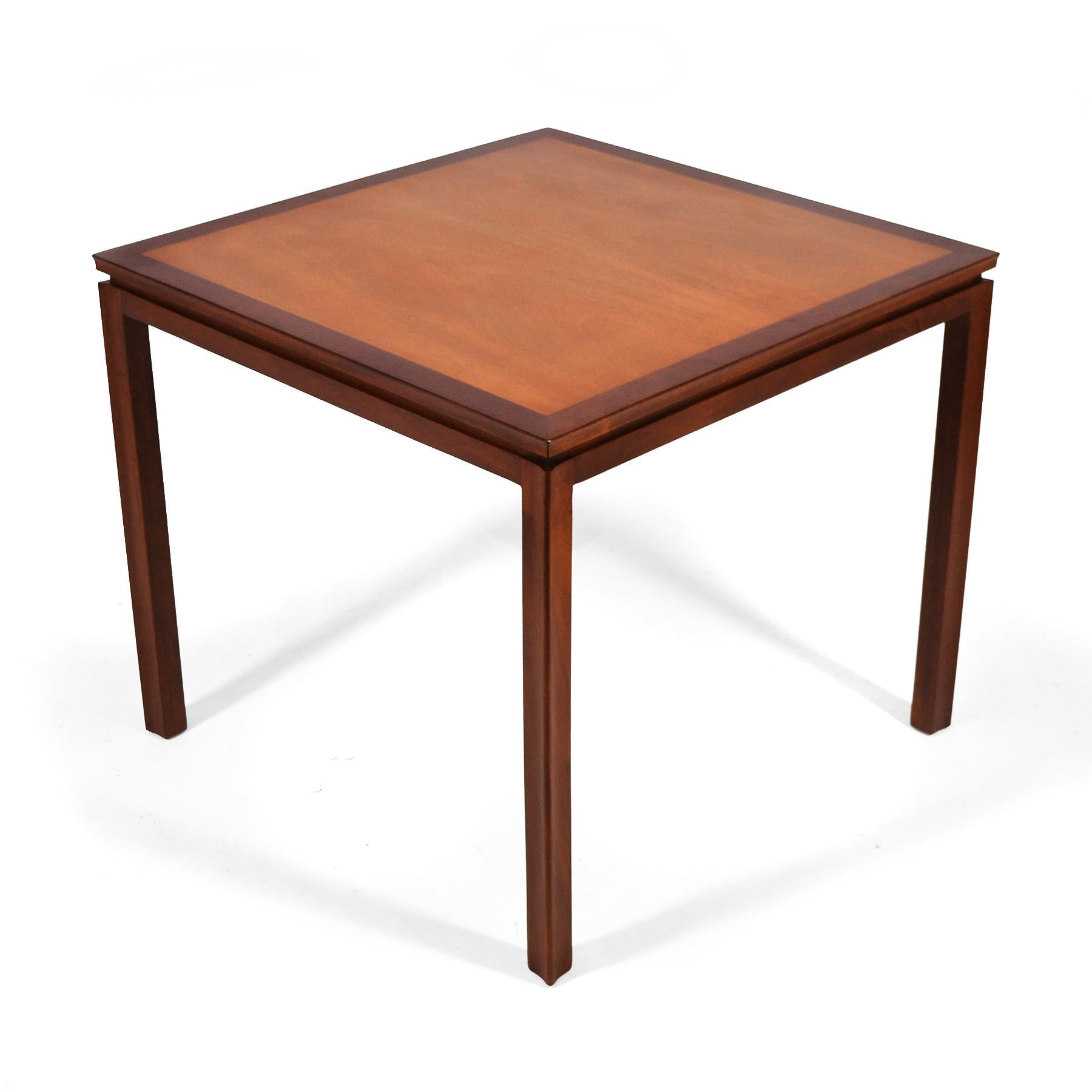 A beautiful design with a wonderful scale and delightful details, this Edward Wormley designed game table by Dunbar is expertly crafted of walnut and mahogany and has just been professionally refinished