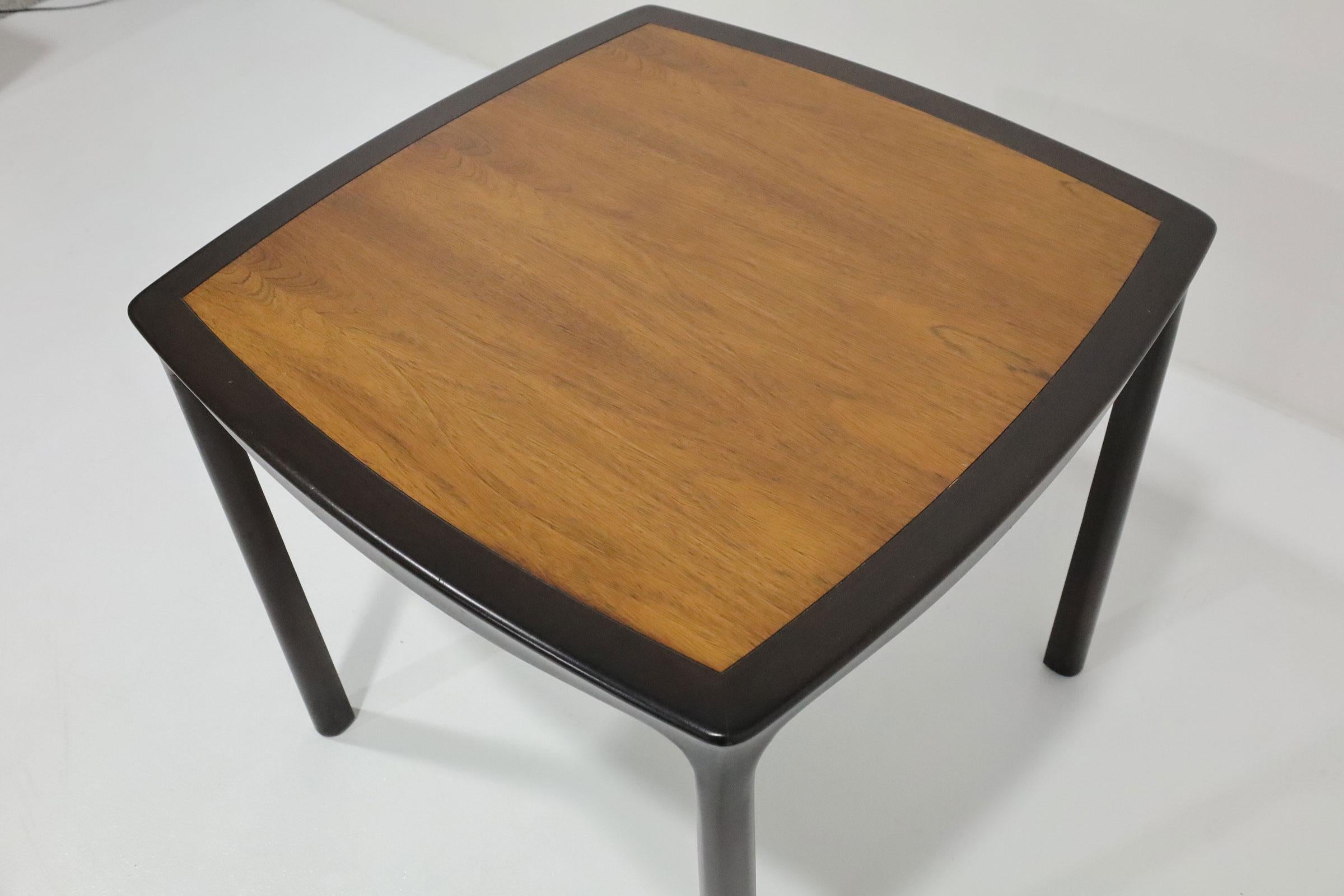 Game table model no 6348 with gently curved sides in dark mahogany with Brazilian rosewood top by Edward Wormley for Dunbar, American 1963 (original Dunbar label on bottom). A timeless Wormley design.